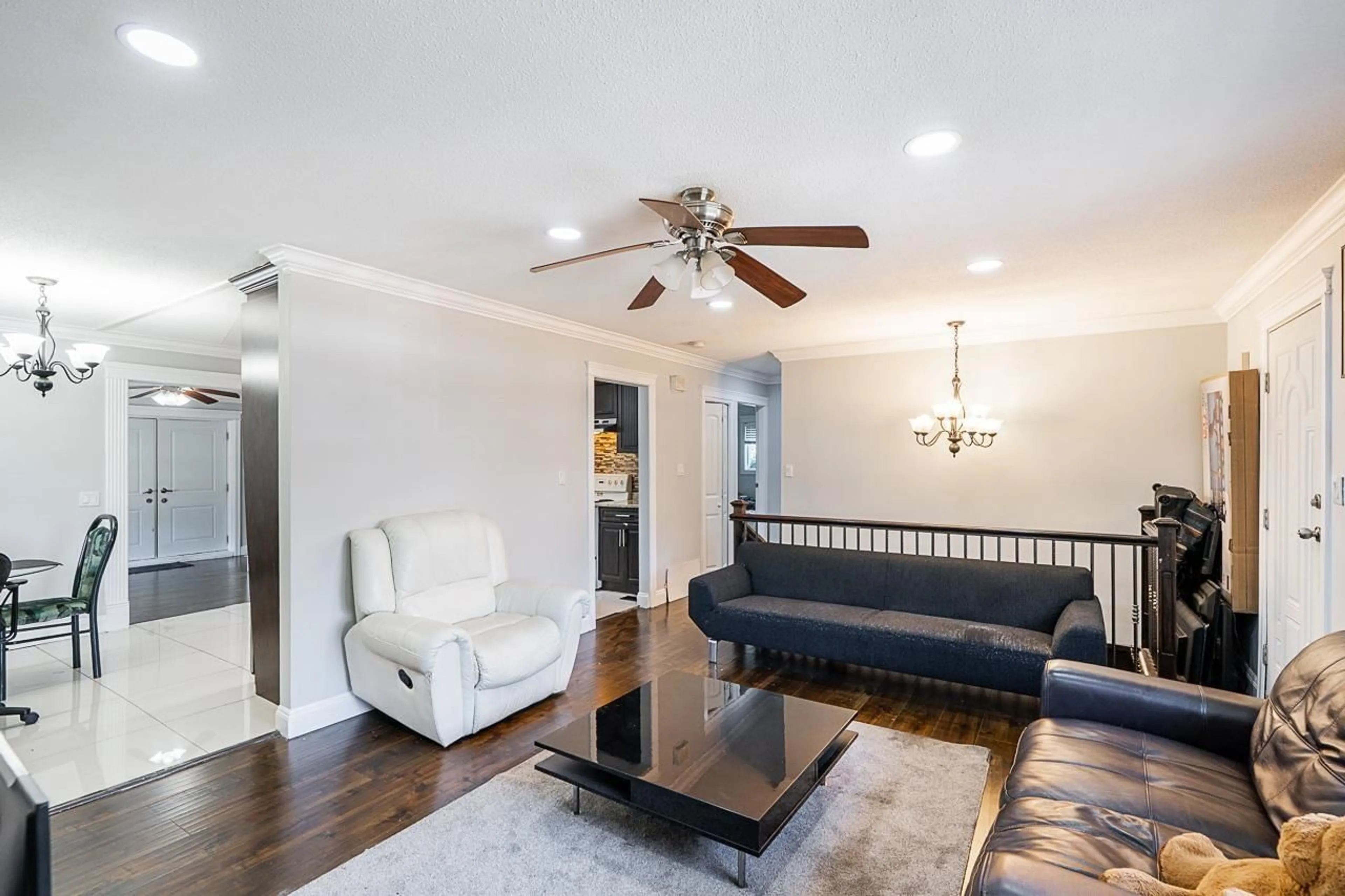 Living room with furniture, wood/laminate floor for 12892 111 AVENUE, Surrey British Columbia V3T2R4
