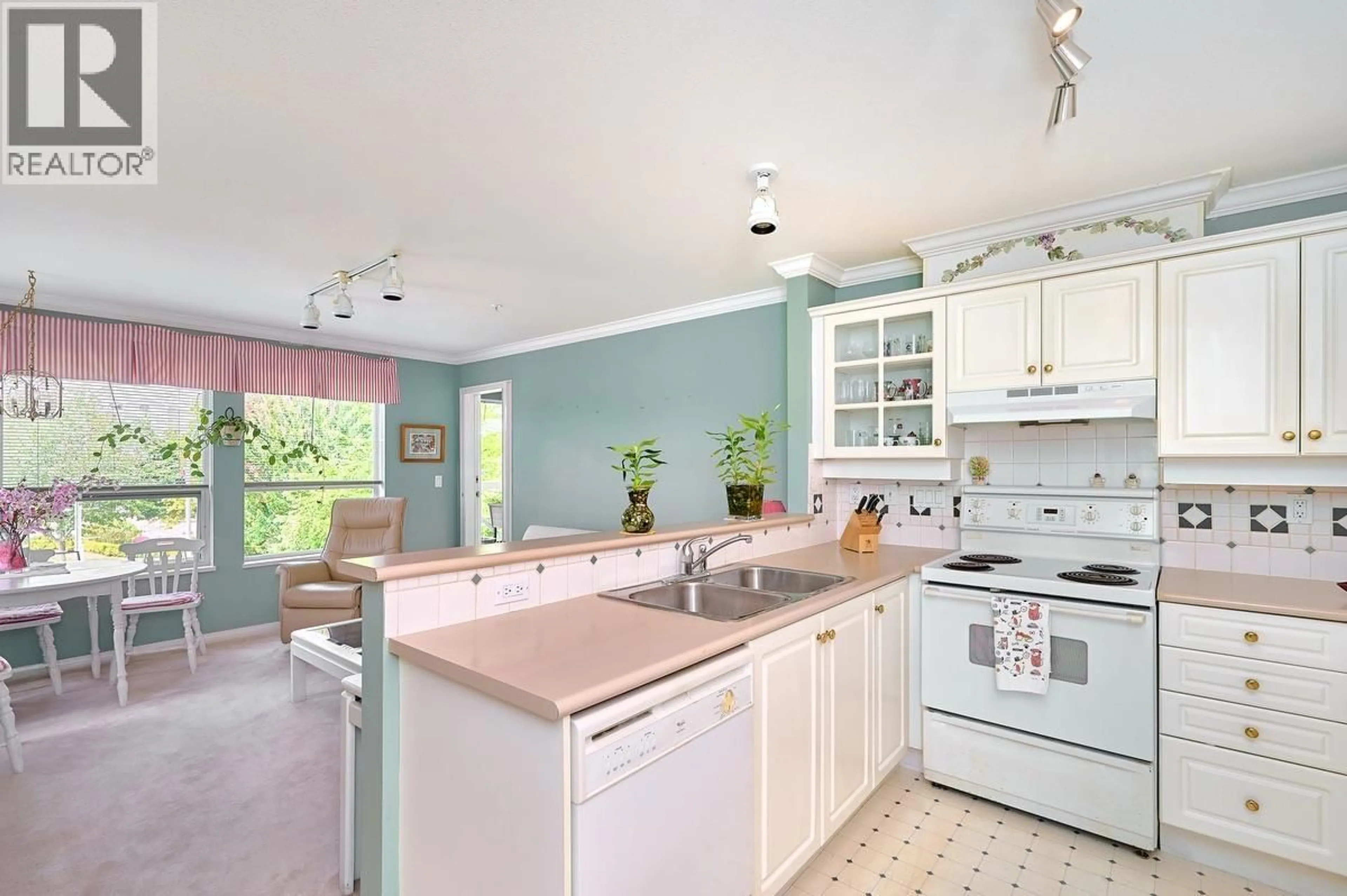 Open concept kitchen, ceramic/tile floor for 211 - 12911 RAILWAY AVENUE, Richmond British Columbia V7E6L8