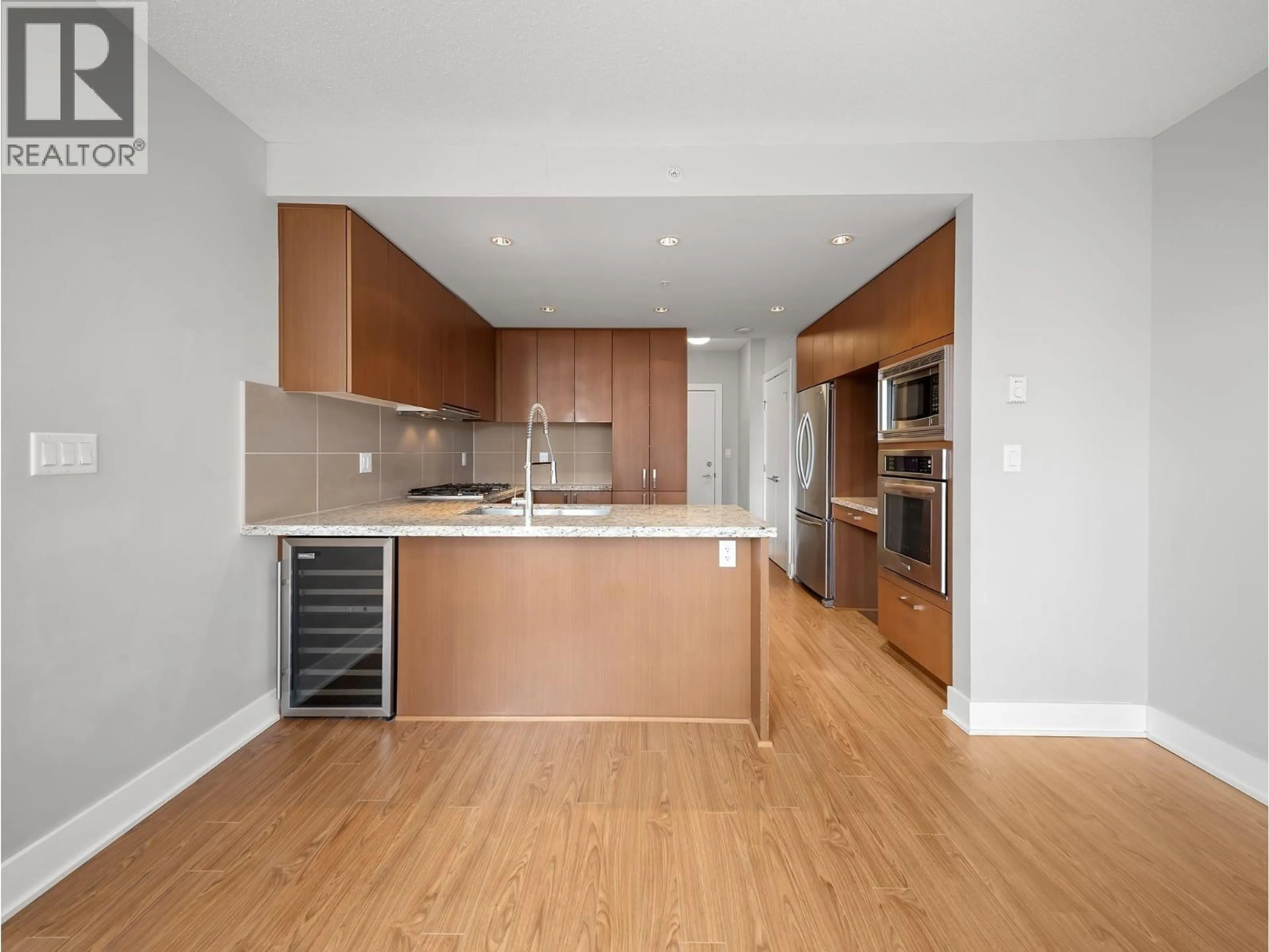 Open concept kitchen, wood/laminate floor for 1208 - 1155 THE HIGH STREET, Coquitlam British Columbia V3B7W4