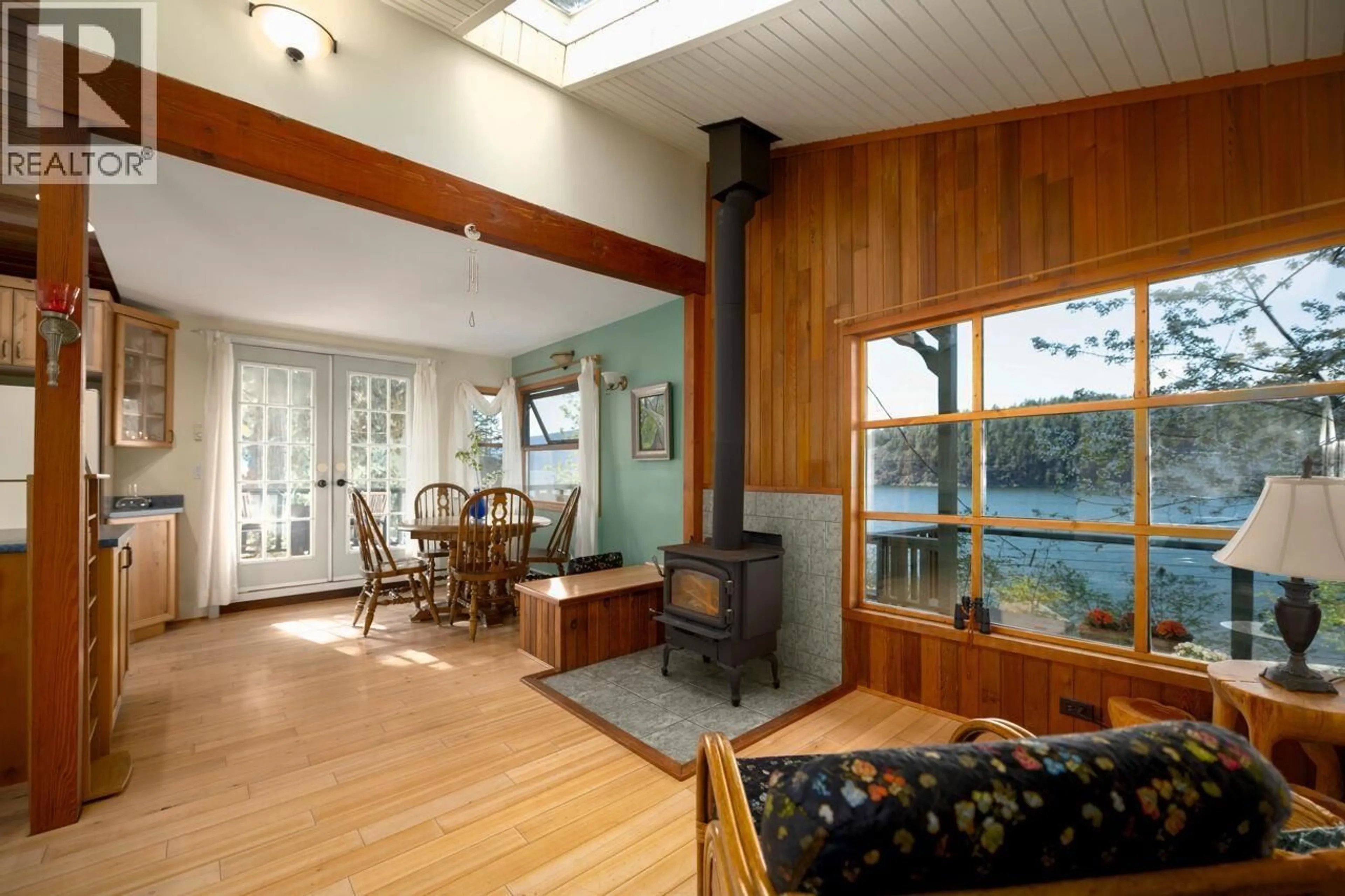 Living room with furniture, wood/laminate floor for 1587 MOUNT GARDNER ROAD, Bowen Island British Columbia V0N1G2