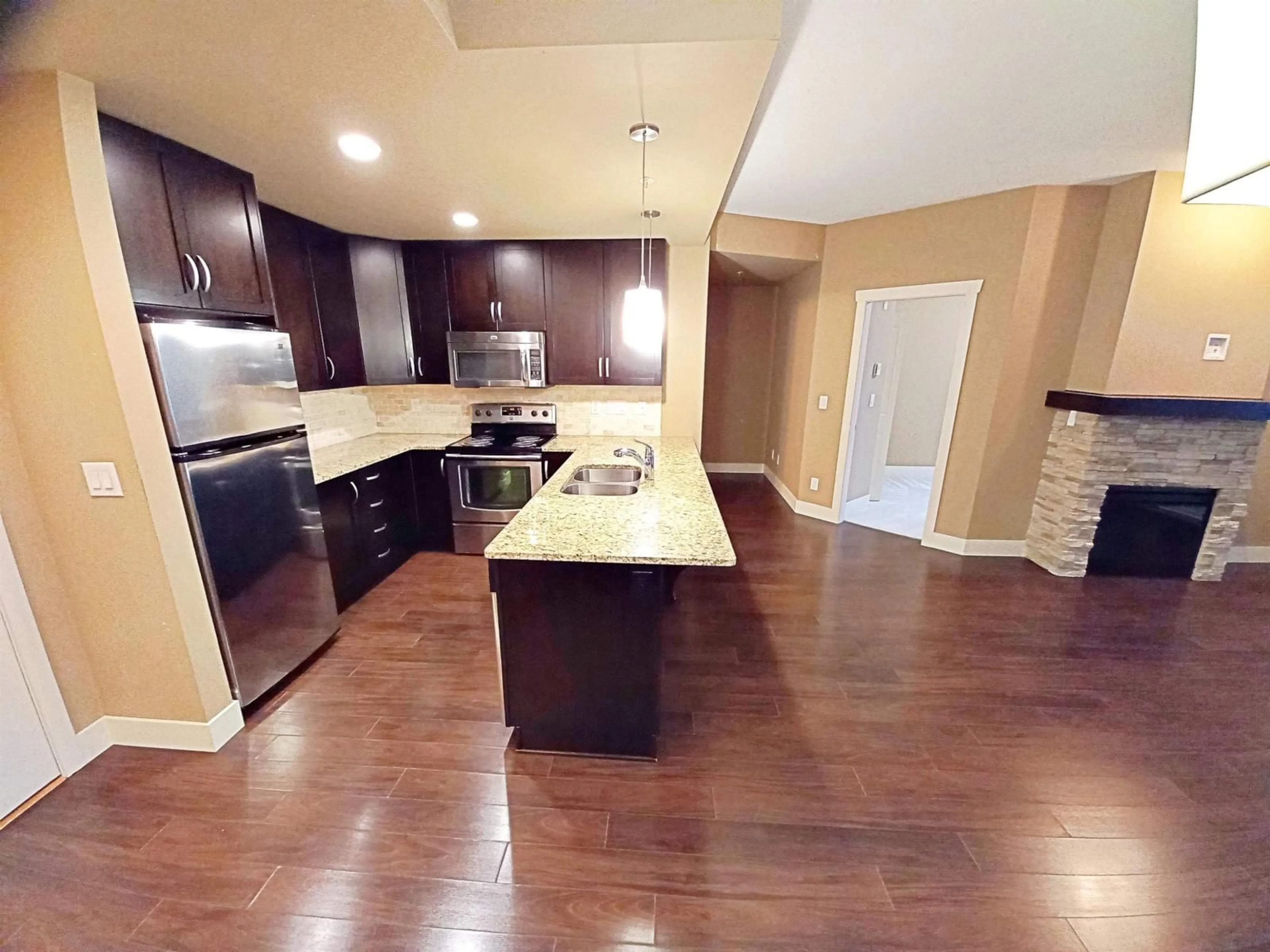 Open concept kitchen, unknown for 218 - 3192 GLADWIN ROAD, Abbotsford British Columbia V2T6M9