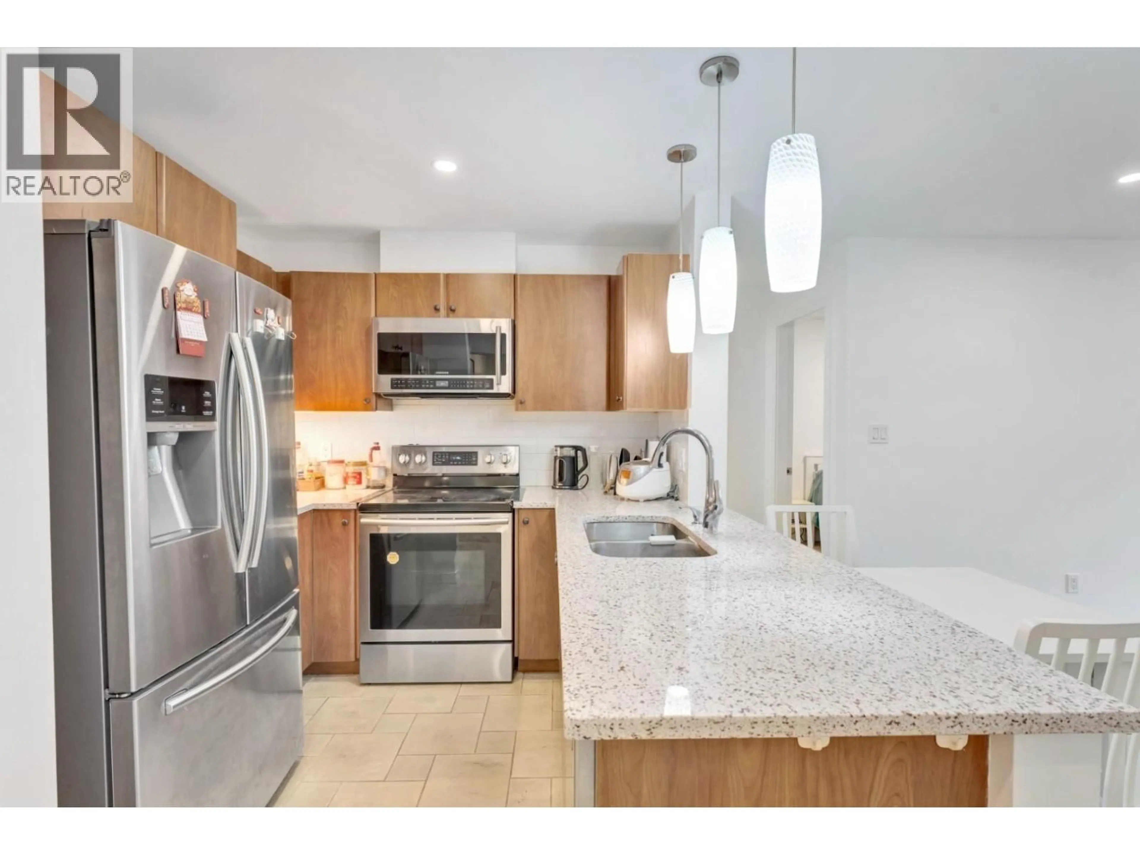 Open concept kitchen, ceramic/tile floor for 320 - 6508 DENBIGH AVENUE, Burnaby British Columbia V5H4W6