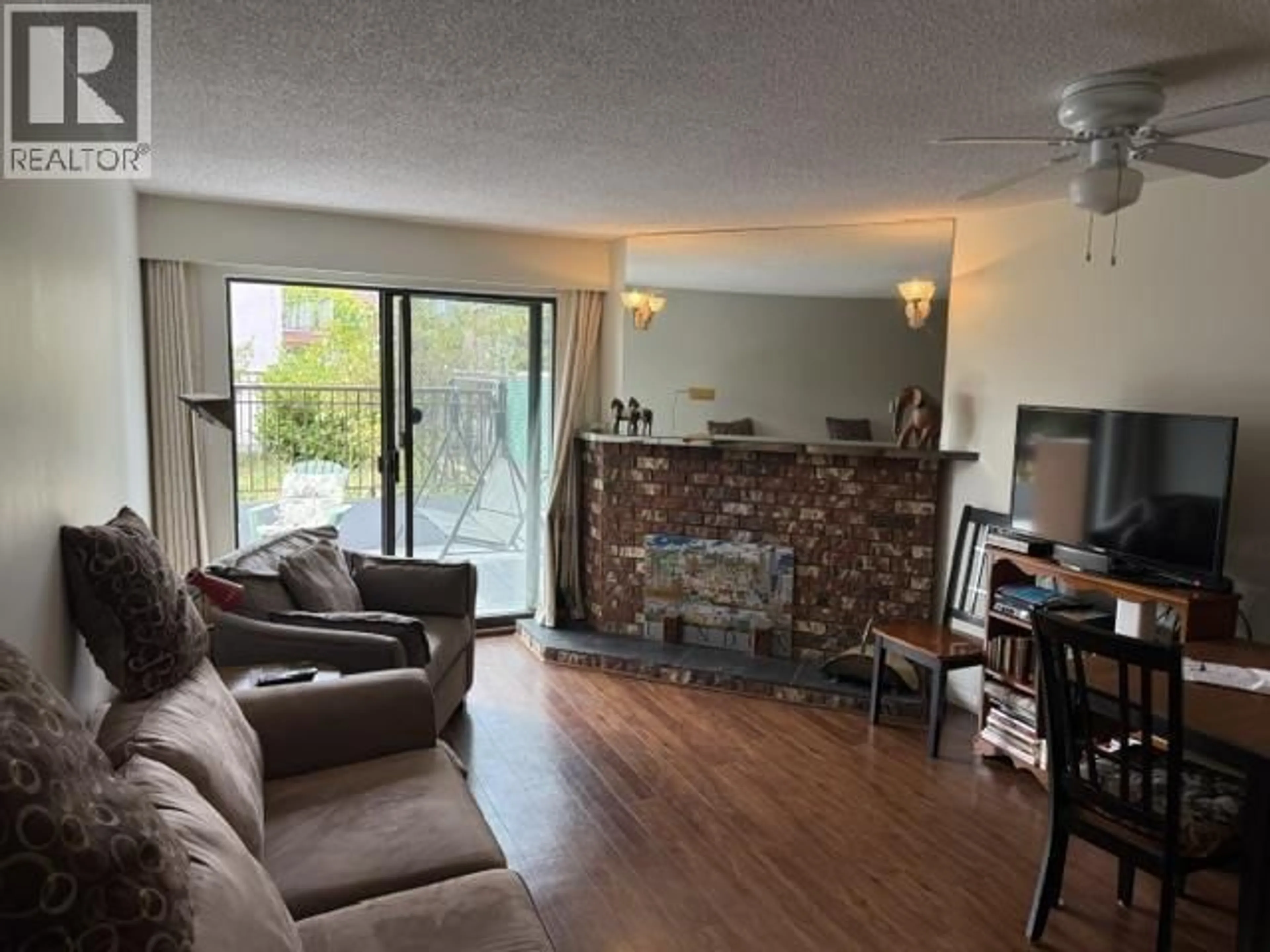 Living room with furniture, wood/laminate floor for 103 - 5155 IMPERIAL STREET, Burnaby British Columbia V5J1E3