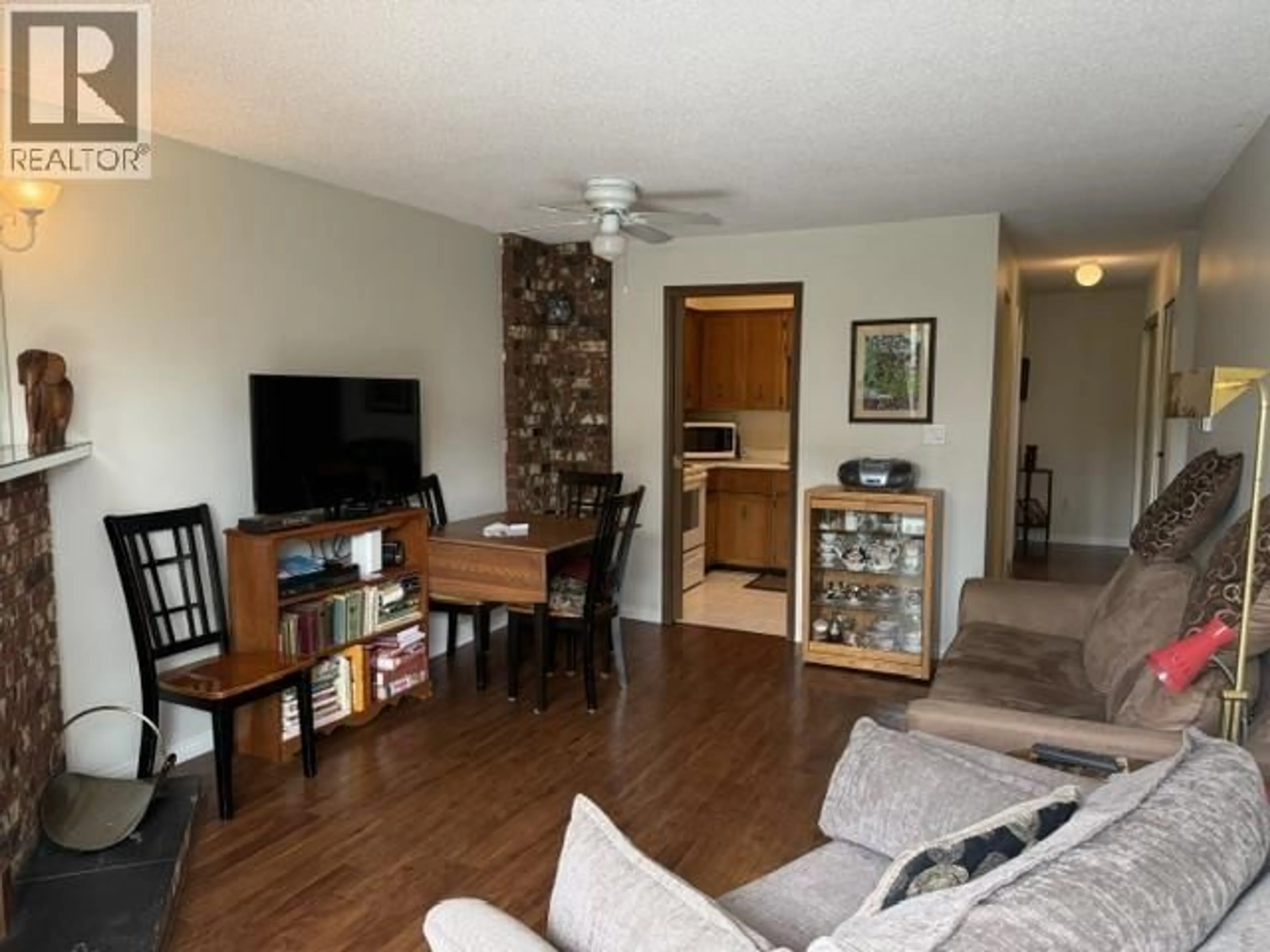 Living room with furniture, wood/laminate floor for 103 - 5155 IMPERIAL STREET, Burnaby British Columbia V5J1E3
