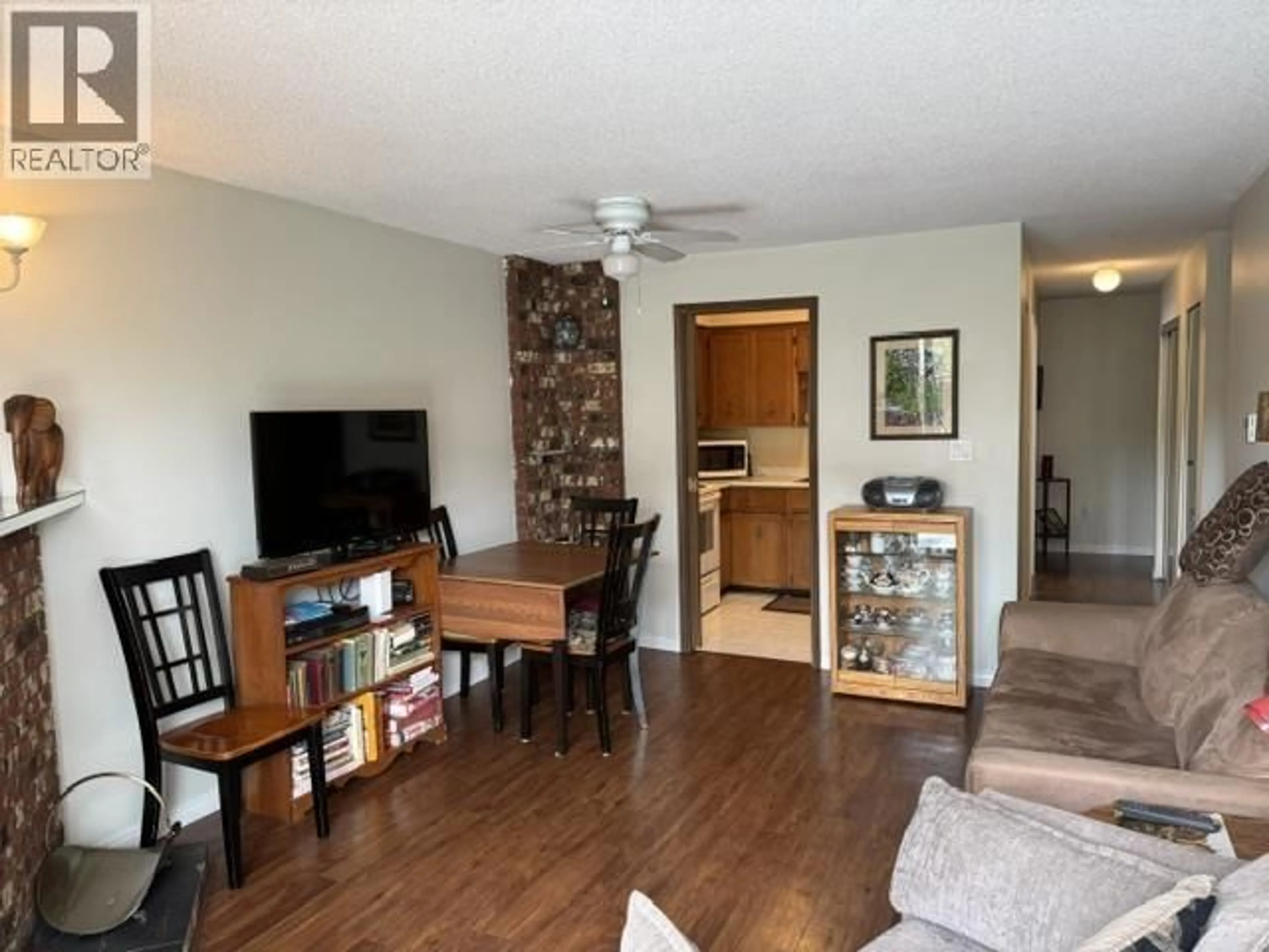 Living room with furniture, wood/laminate floor for 103 - 5155 IMPERIAL STREET, Burnaby British Columbia V5J1E3