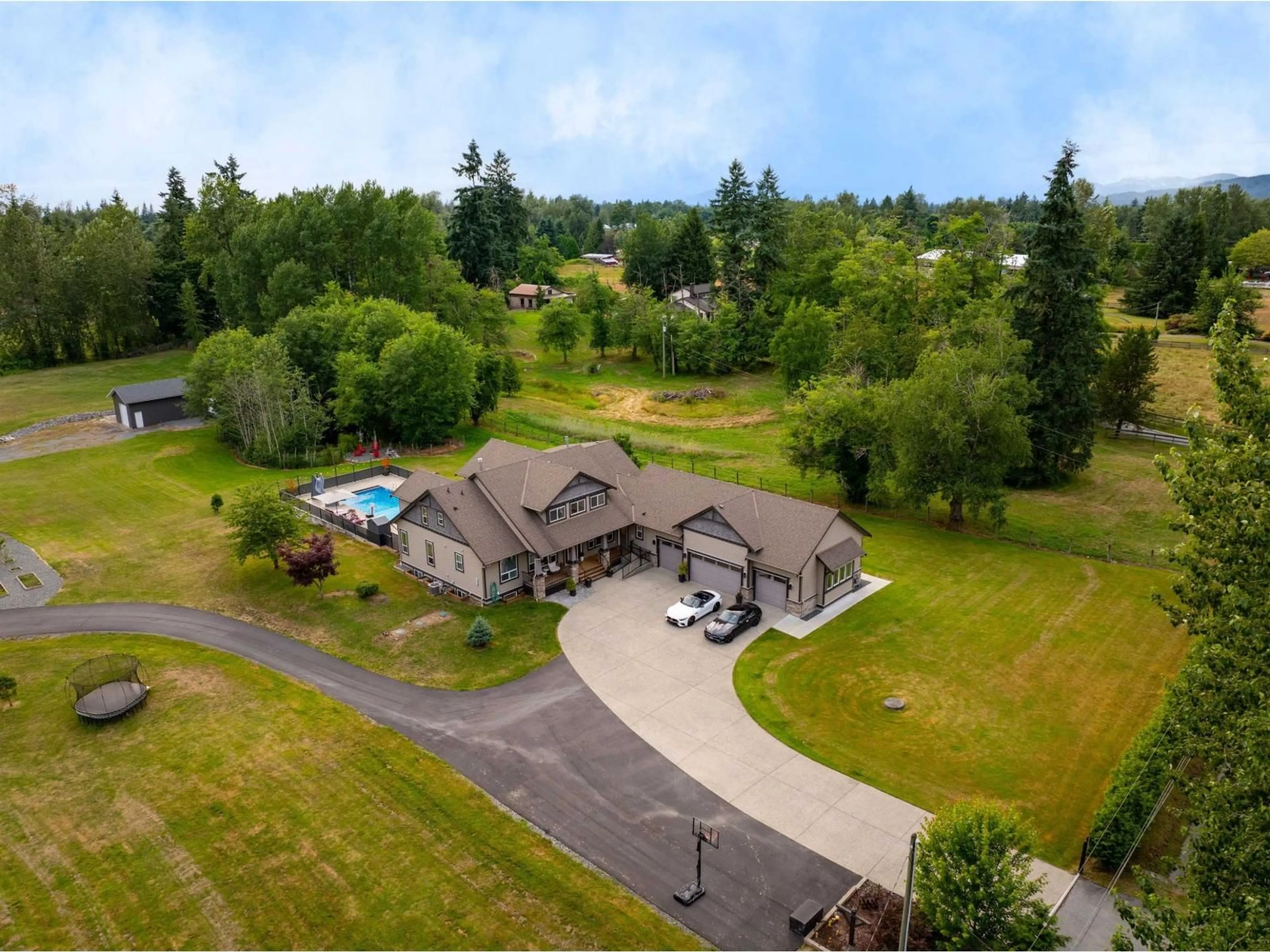 A pic from outside/outdoor area/front of a property/back of a property/a pic from drone, water/lake/river/ocean view for 6453 260 STREET, Langley British Columbia V4W1V3