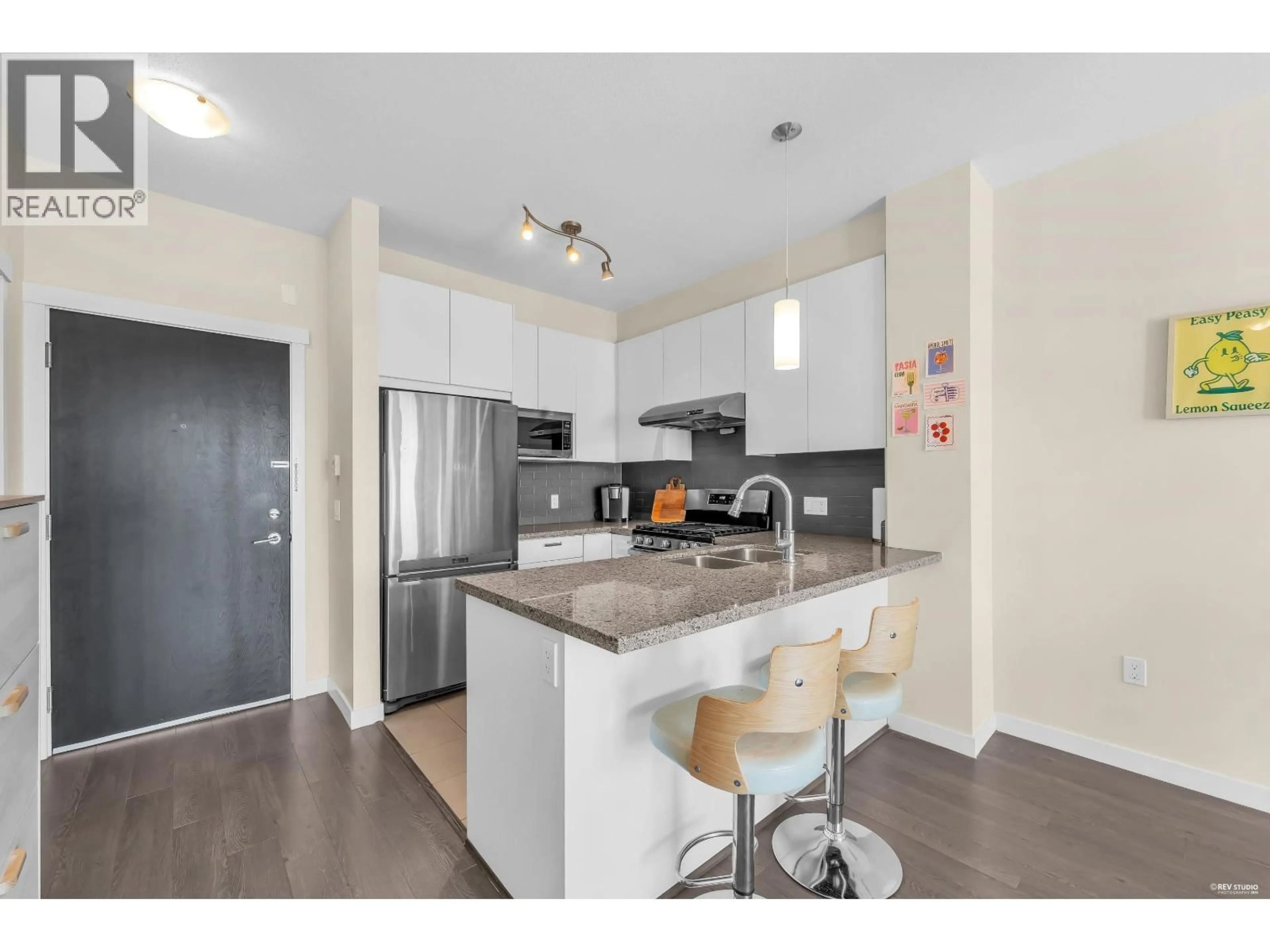 Open concept kitchen, wood/laminate floor for 430 - 9388 MCKIM WAY, Richmond British Columbia V6X0J7