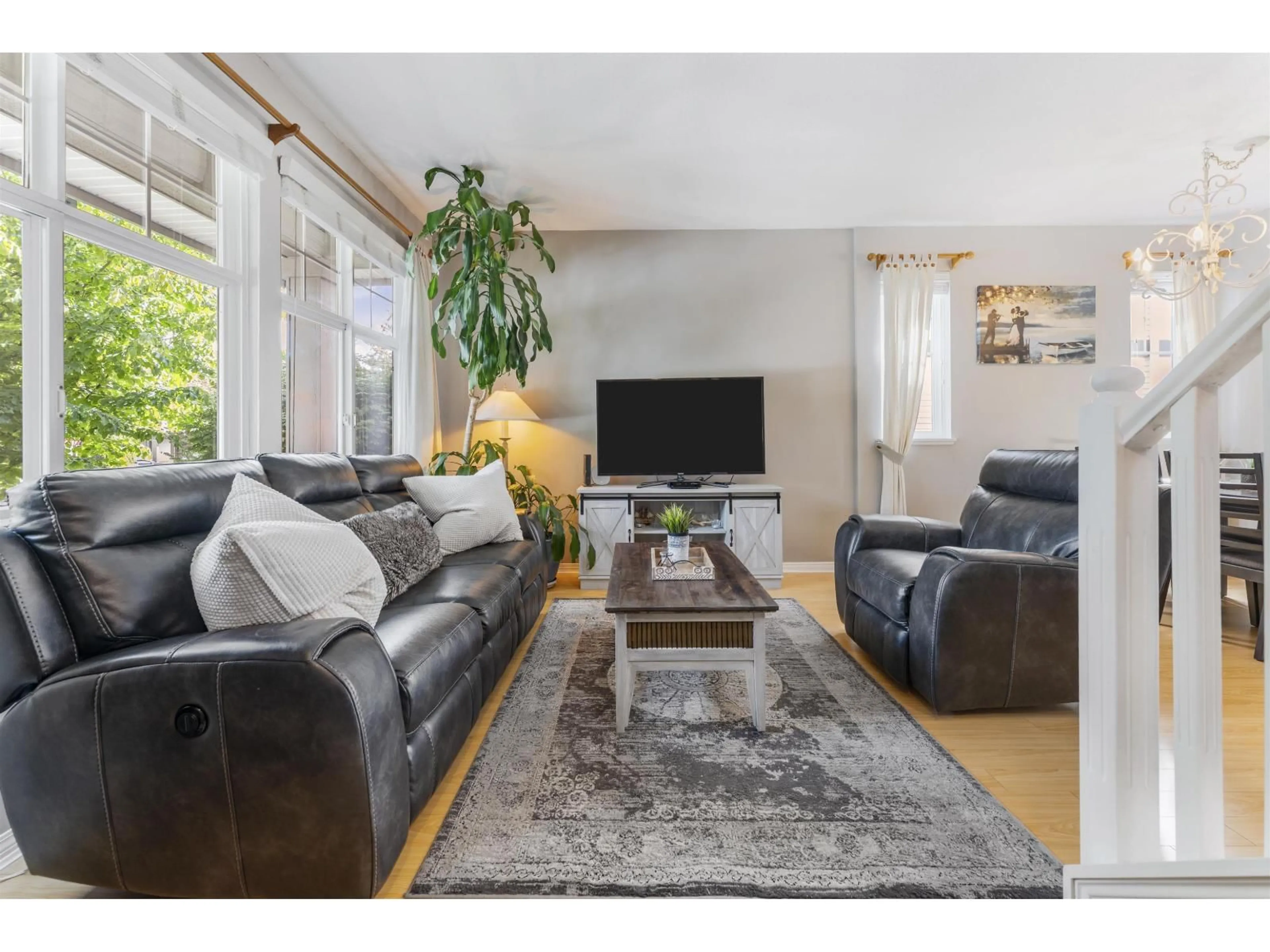 Living room with furniture, wood/laminate floor for 14876 56A AVENUE, Surrey British Columbia V3S8X1