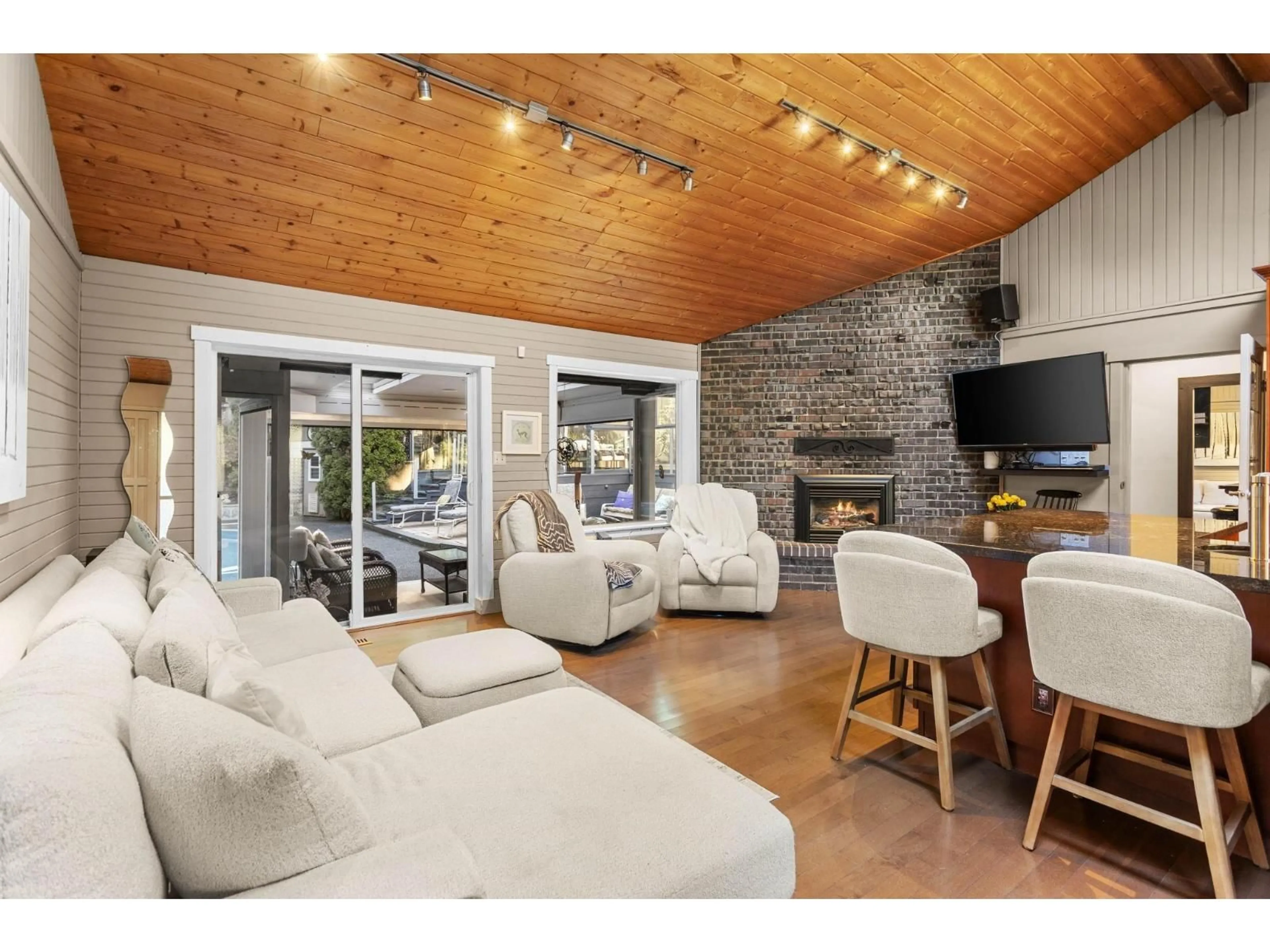 Living room with furniture, wood/laminate floor for 23808 58A AVENUE, Langley British Columbia V2Z1A5