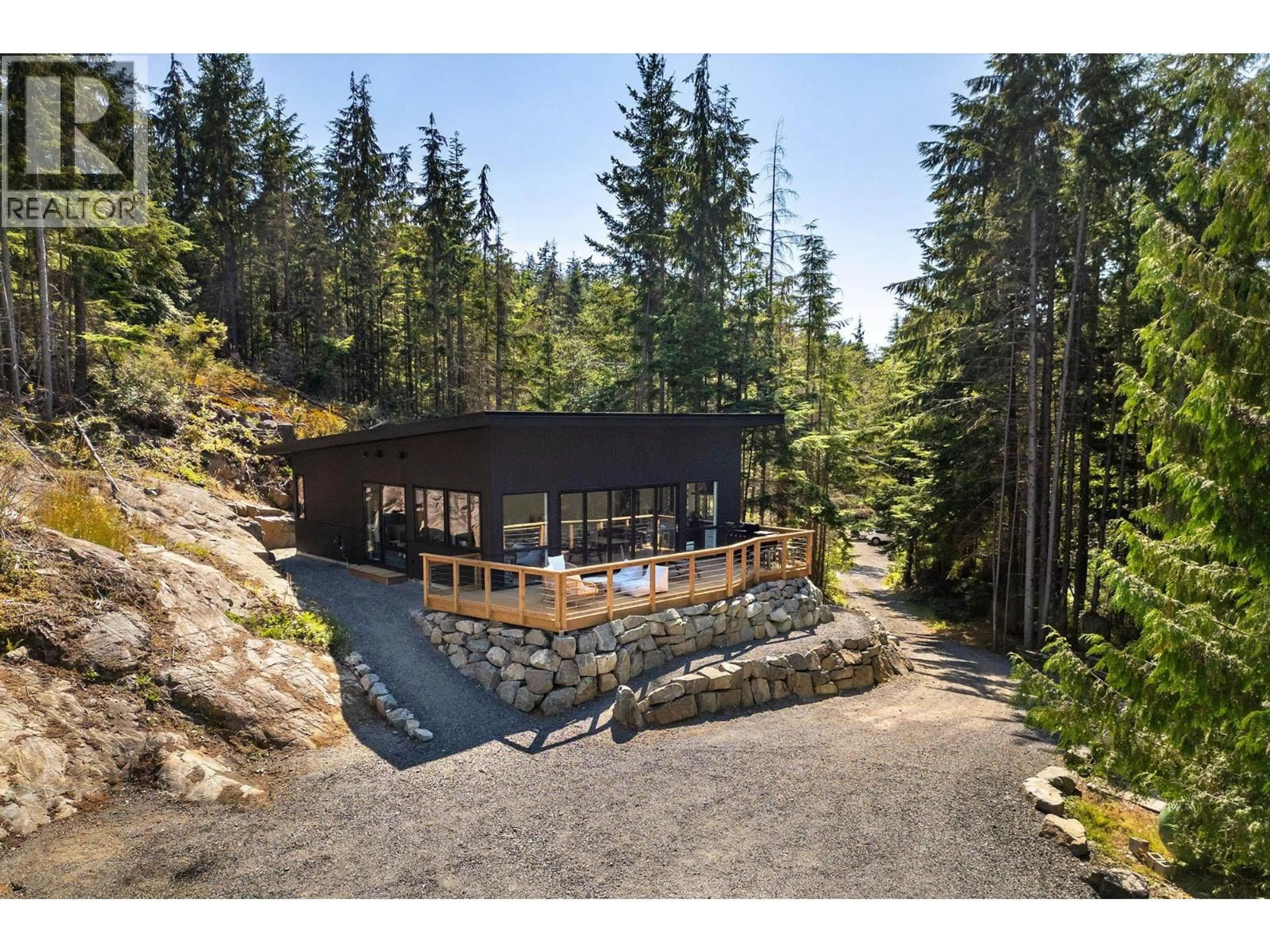 A pic from outside/outdoor area/front of a property/back of a property/a pic from drone, forest/trees view for 1290 COWAN POINT DRIVE, Bowen Island British Columbia V0N1G2