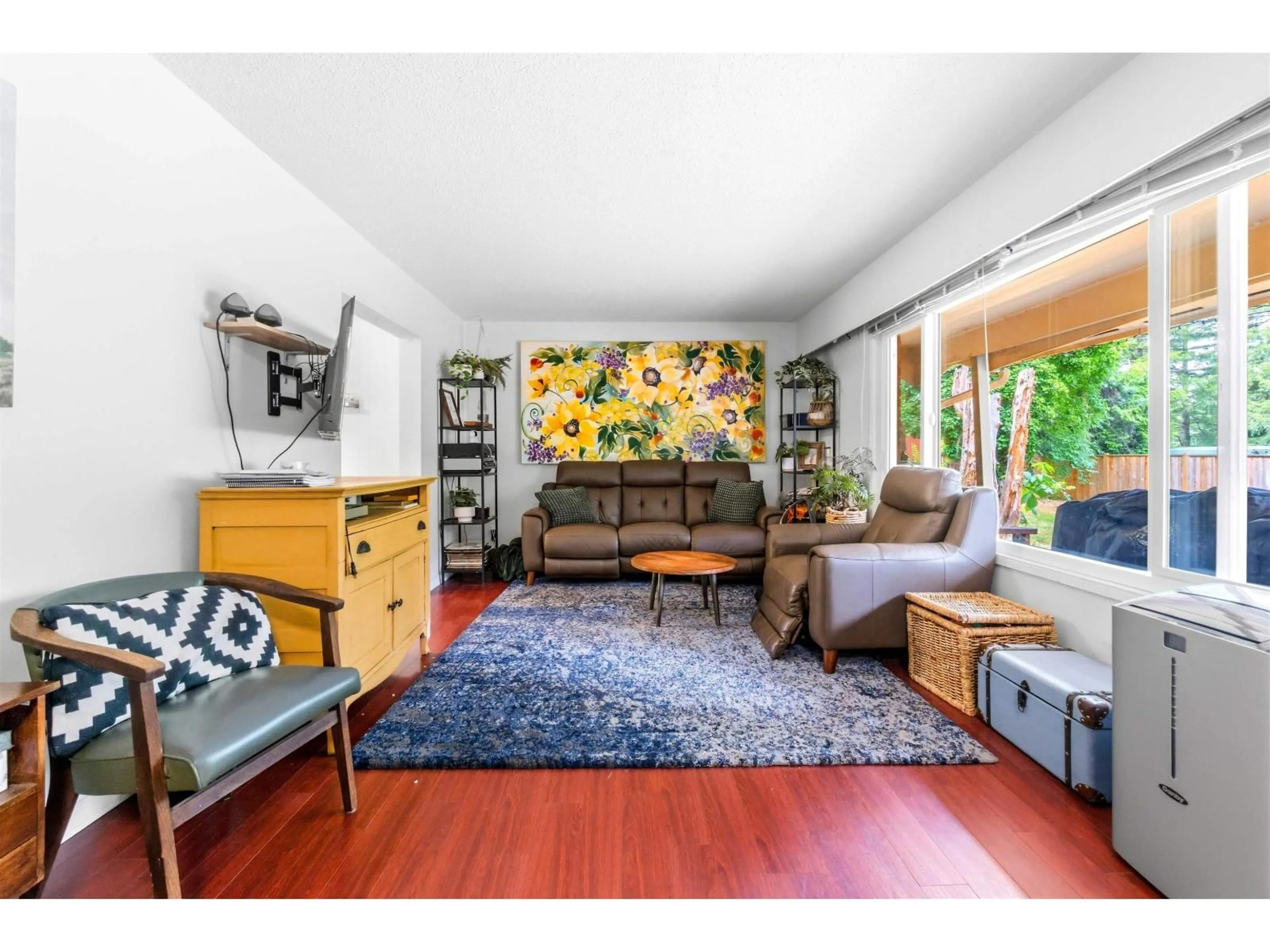 Living room with furniture, wood/laminate floor for 23338 56 AVENUE, Langley British Columbia V2Z2P7