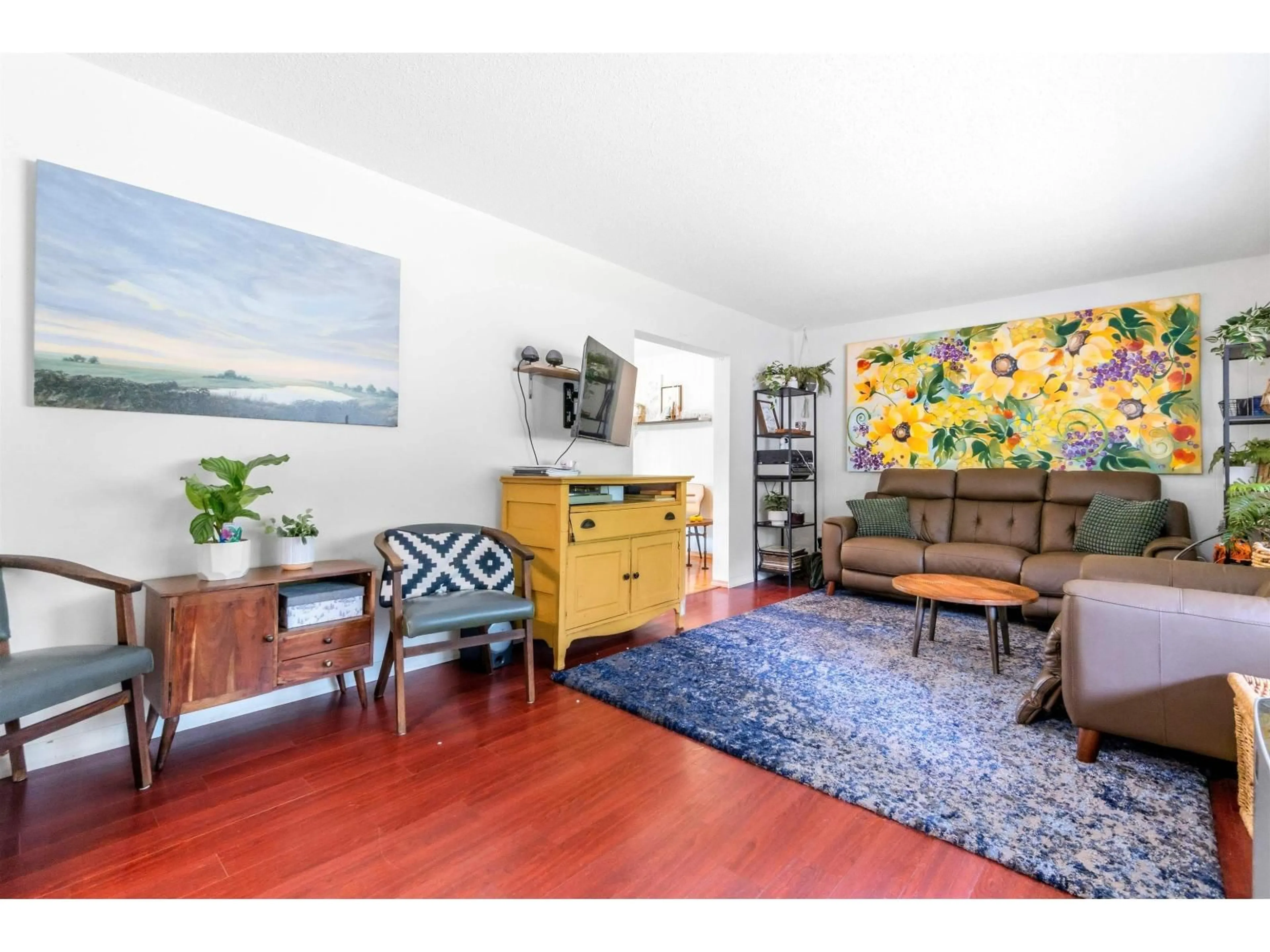 Living room with furniture, wood/laminate floor for 23338 56 AVENUE, Langley British Columbia V2Z2P7