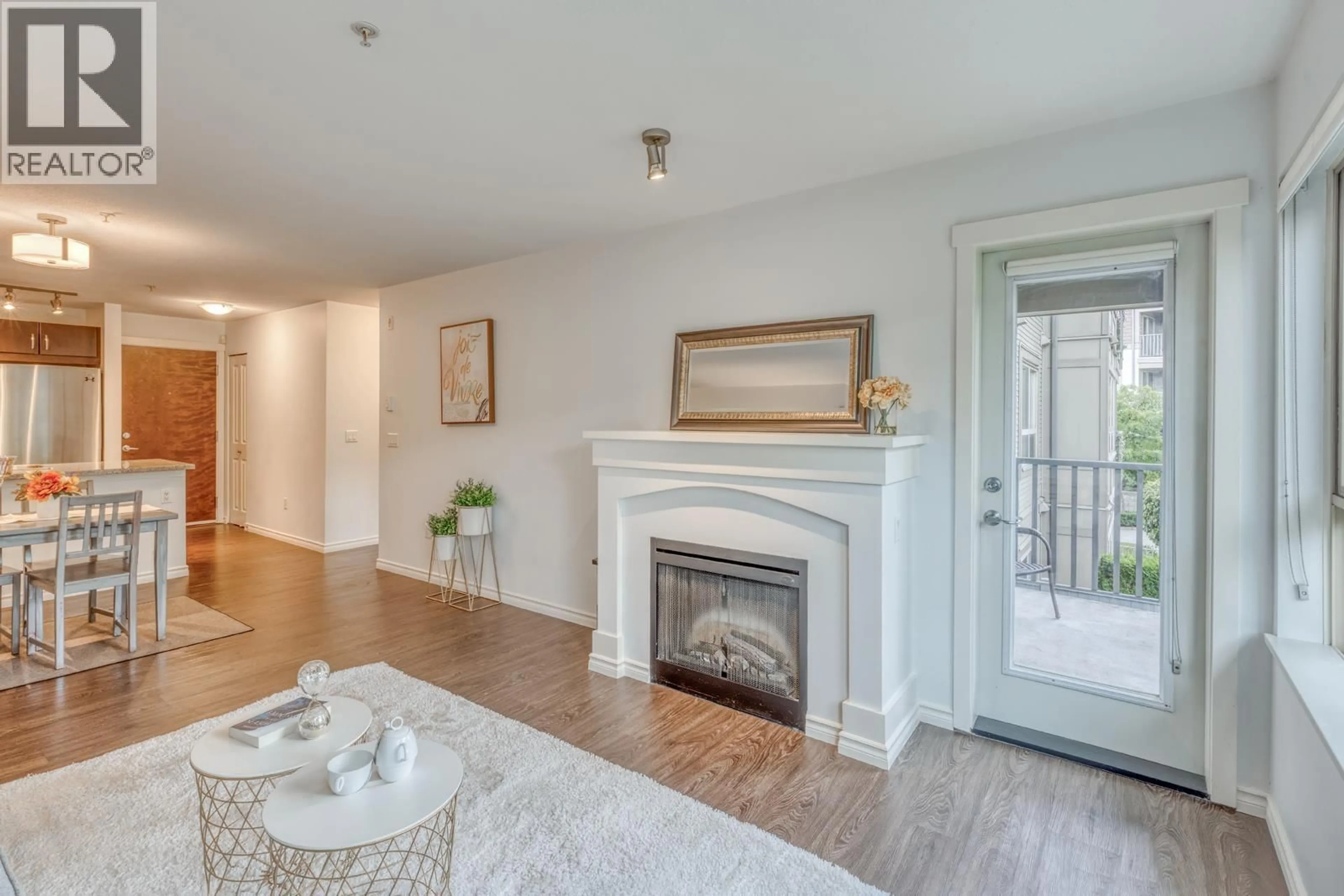 Living room with furniture, wood/laminate floor for 316 - 3132 DAYANEE SPRINGS BOULEVARD, Coquitlam British Columbia V3E0B5