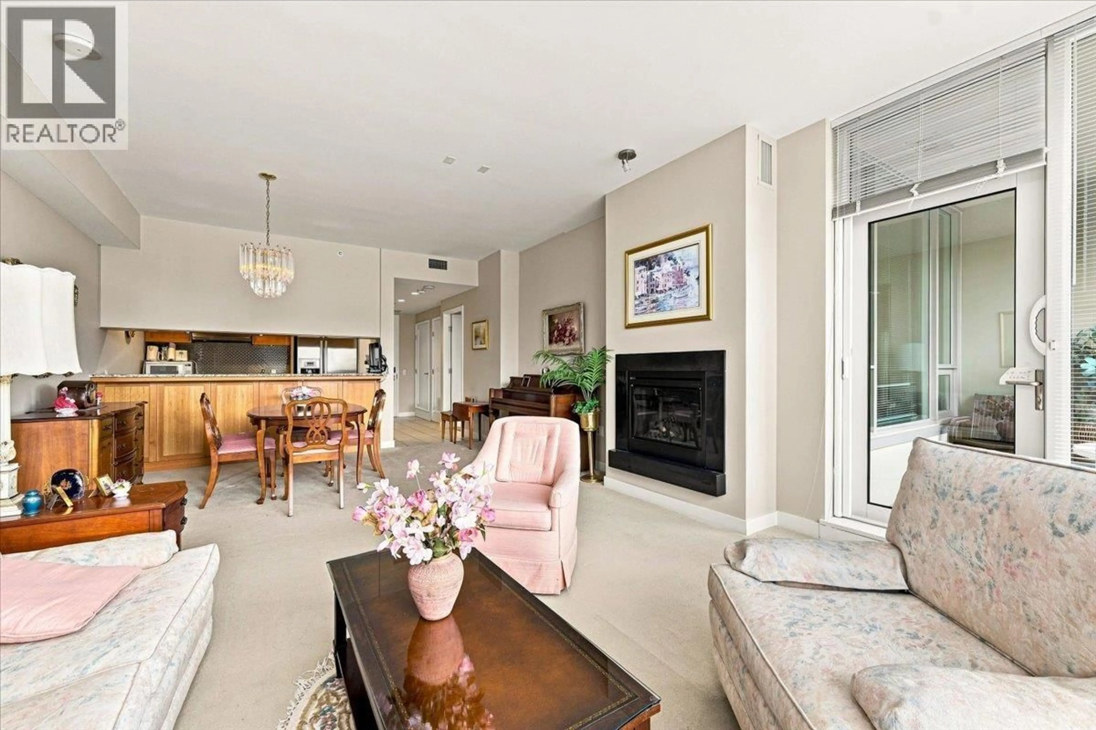 Living room with furniture, ceramic/tile floor for 405 - 3382 WESBROOK MALL, Vancouver British Columbia V6S0A7