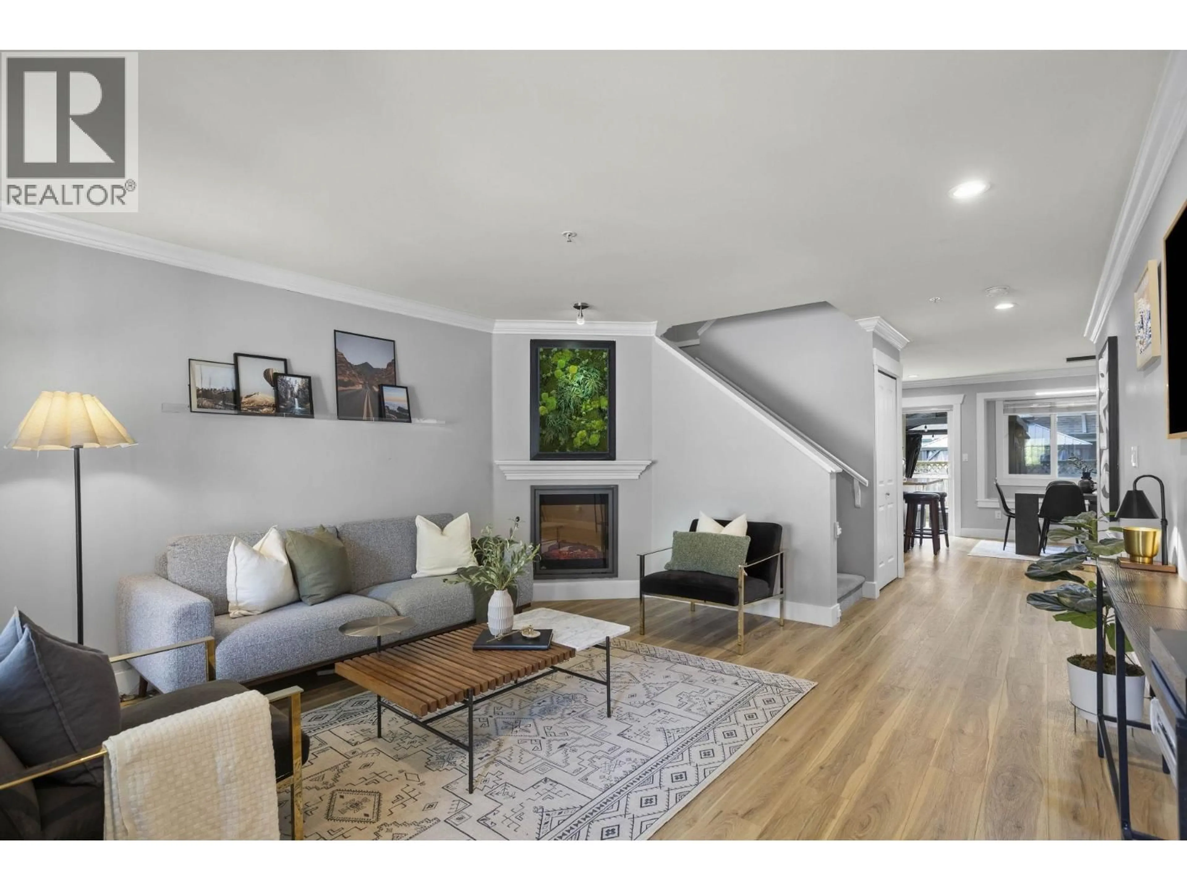 Living room with furniture, wood/laminate floor for 42 - 22977 116 AVENUE, Maple Ridge British Columbia V2X9A8