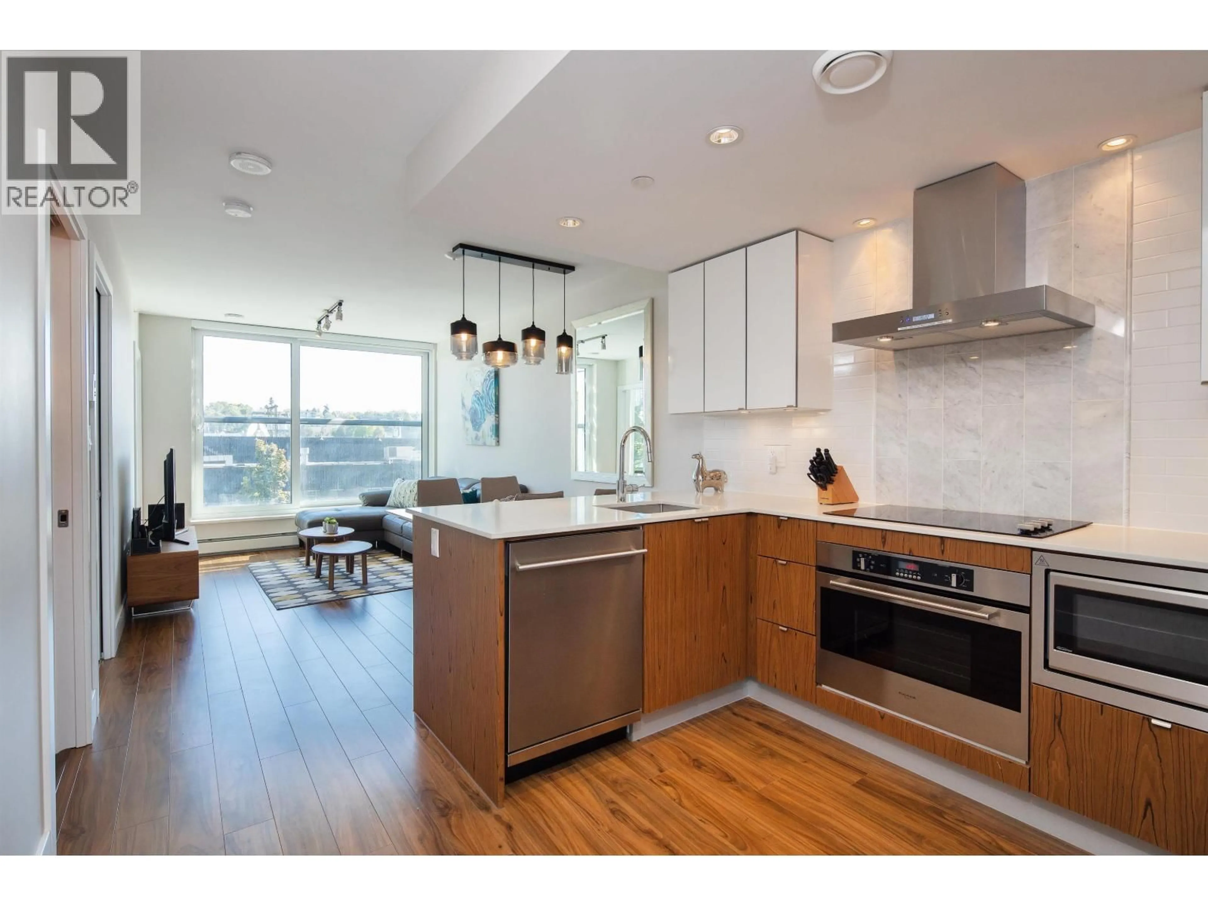 Open concept kitchen, wood/laminate floor for 312 - 159 2ND AVENUE, Vancouver British Columbia V5Y0L8