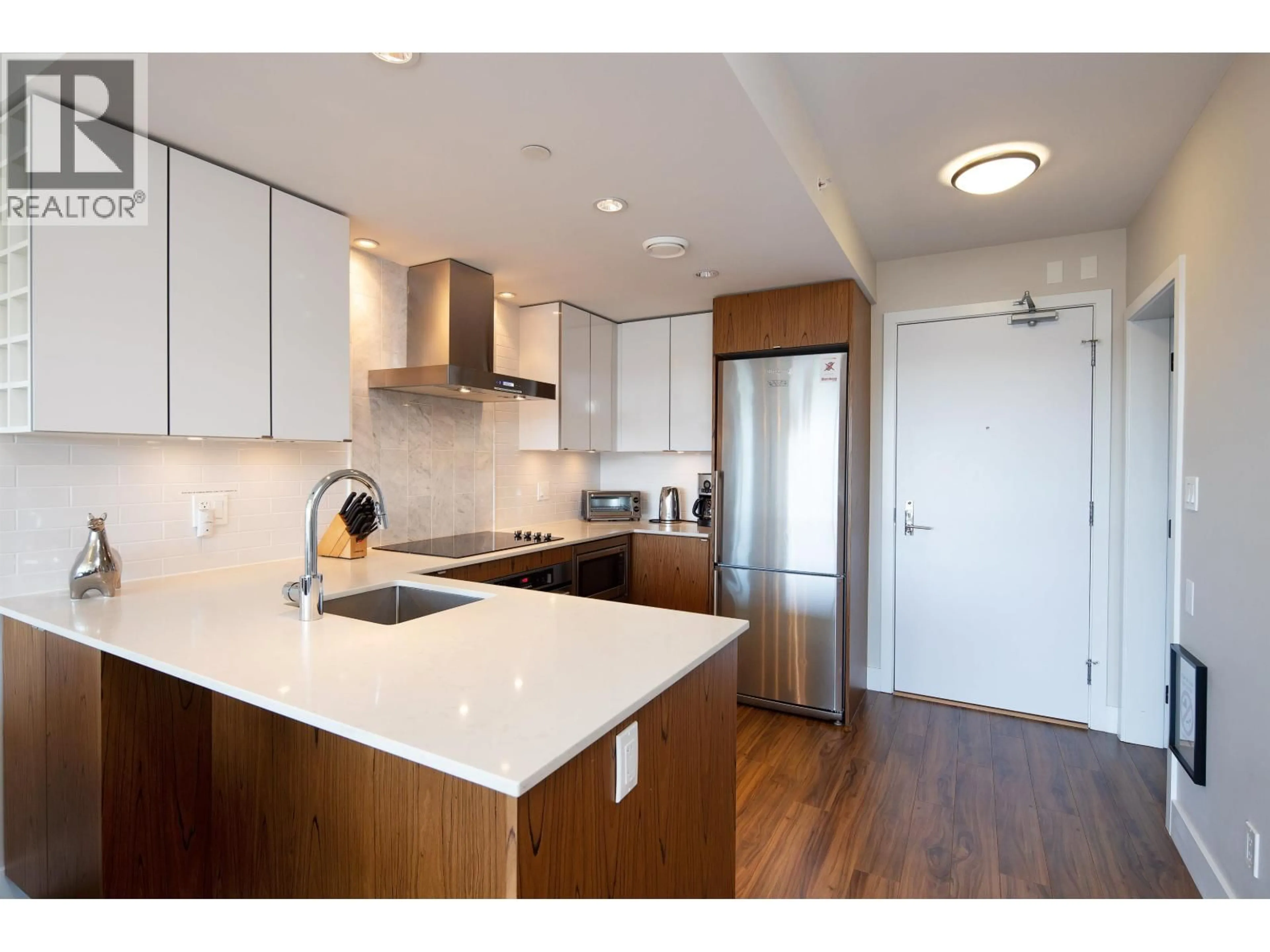 Open concept kitchen, wood/laminate floor for 312 - 159 2ND AVENUE, Vancouver British Columbia V5Y0L8