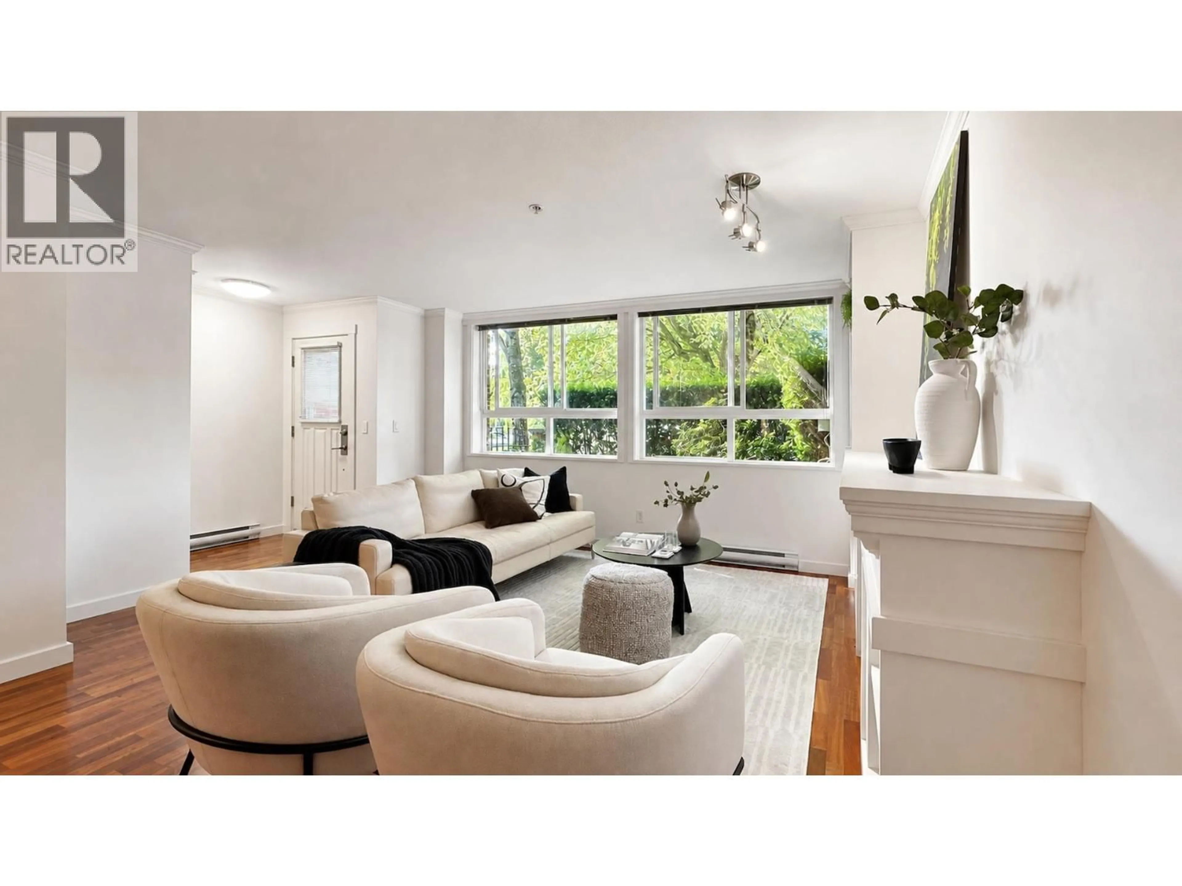 Living room with furniture, wood/laminate floor for 3681 12TH AVENUE, Vancouver British Columbia V6R2N5