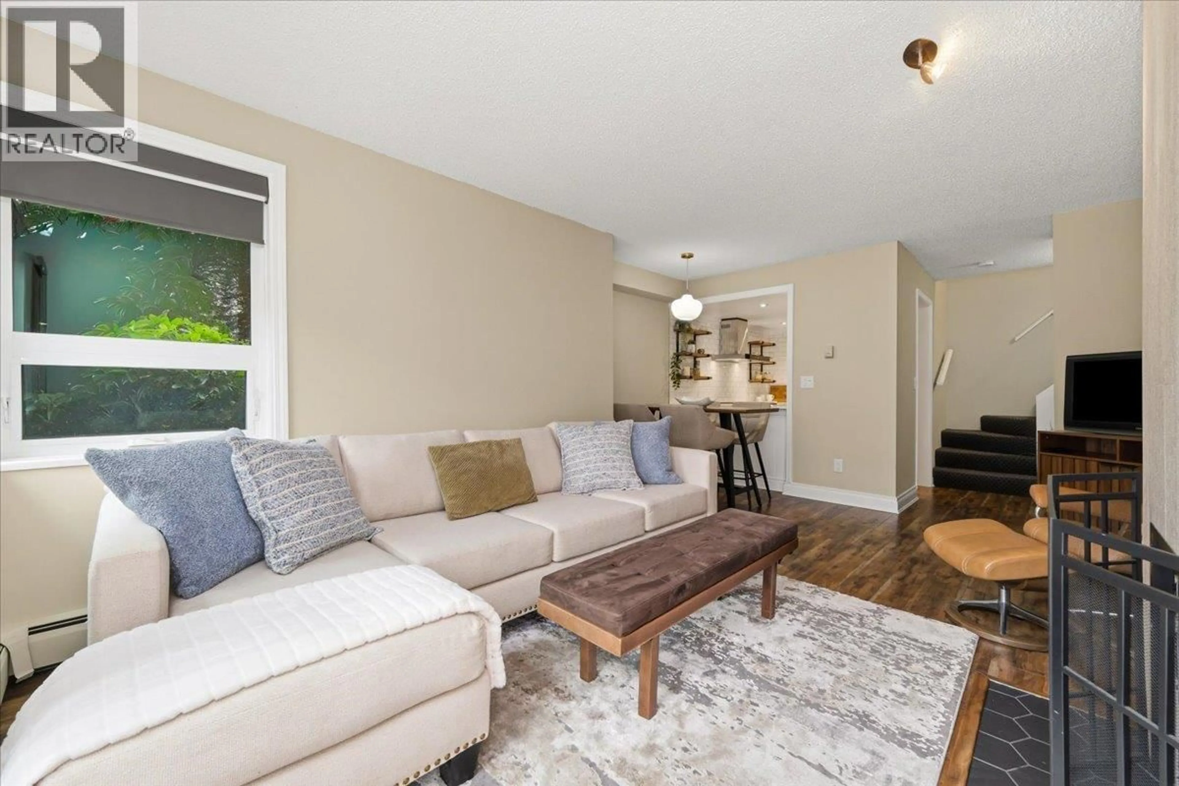 Living room with furniture, wood/laminate floor for 107 - 2455 YORK AVENUE, Vancouver British Columbia V6K1C9