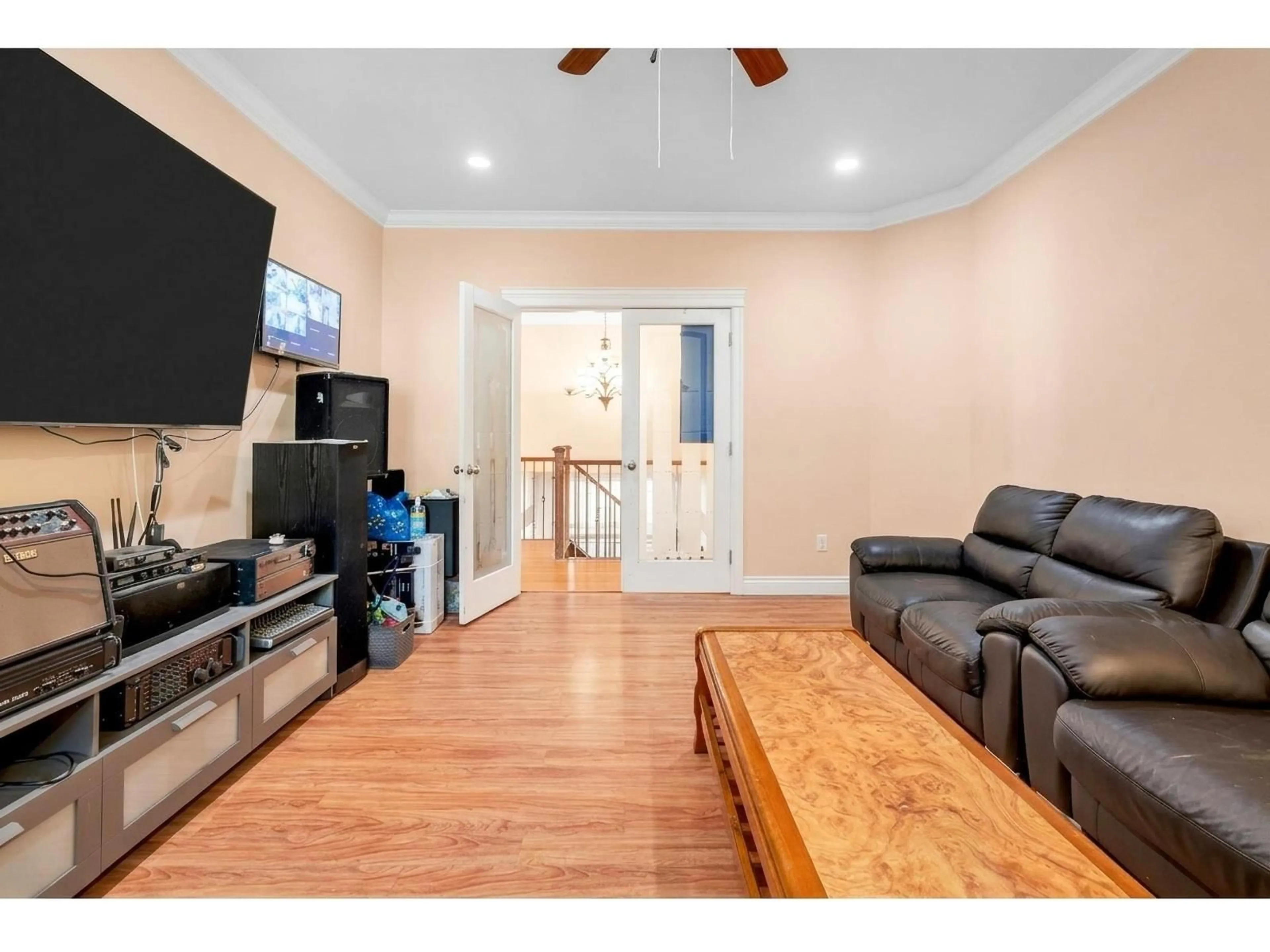 Living room with furniture, wood/laminate floor for 14065 100 AVENUE, Surrey British Columbia V3T1J7