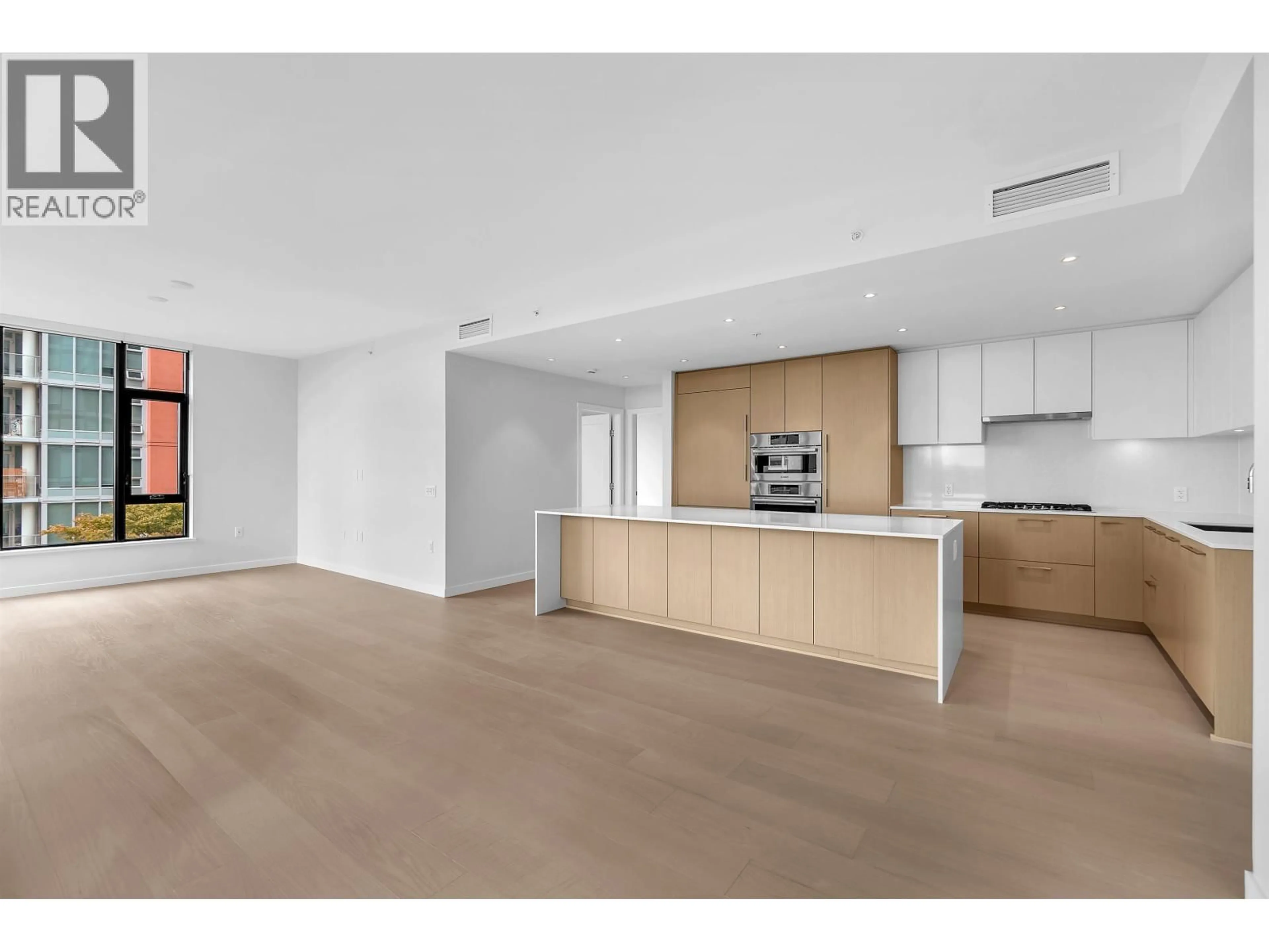 Open concept kitchen, unknown for 506 - 128 15TH STREET, North Vancouver British Columbia V7M0H6