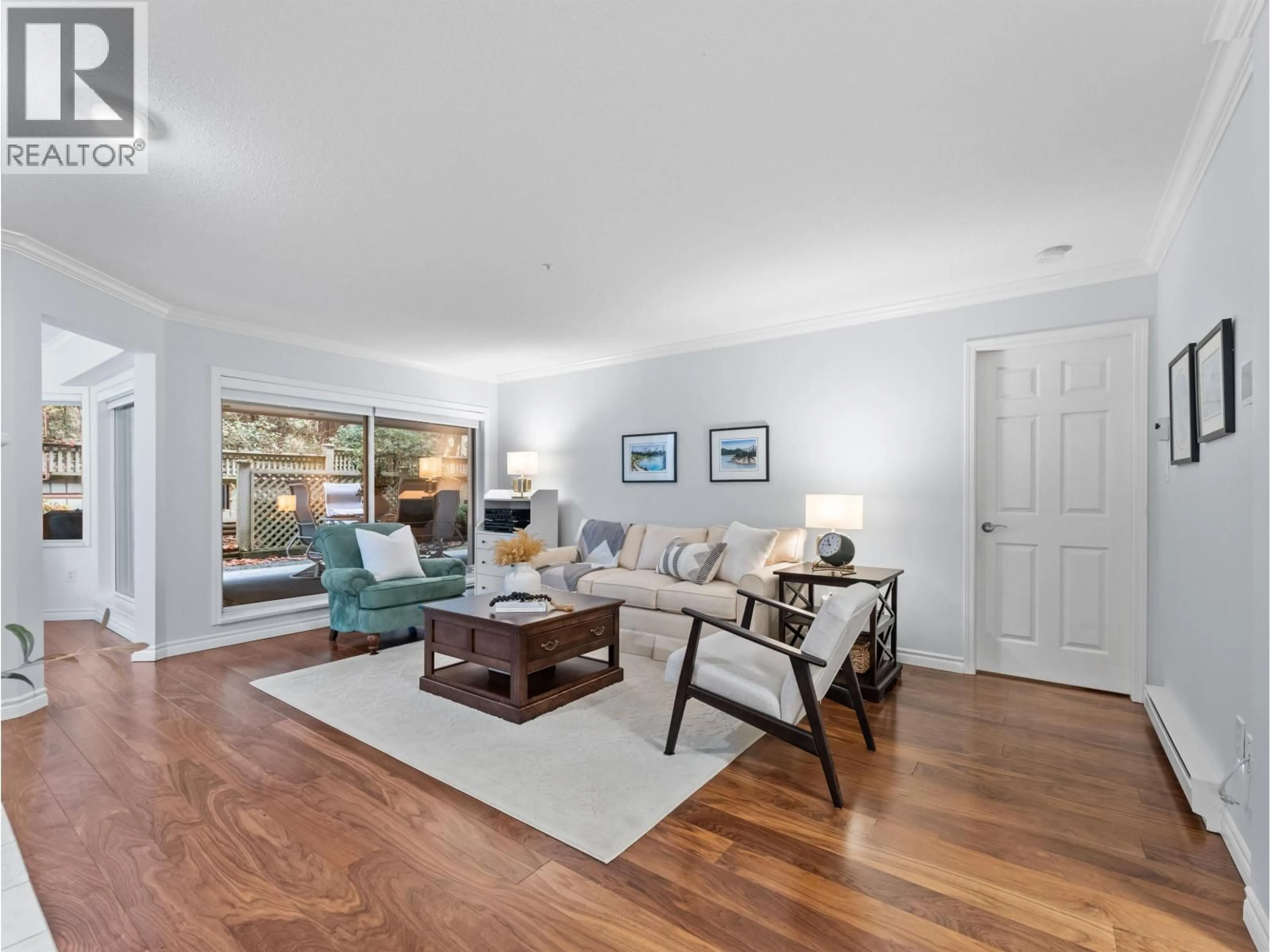 Living room with furniture, wood/laminate floor for 107 - 3690 BANFF COURT, North Vancouver British Columbia V7H2Y7