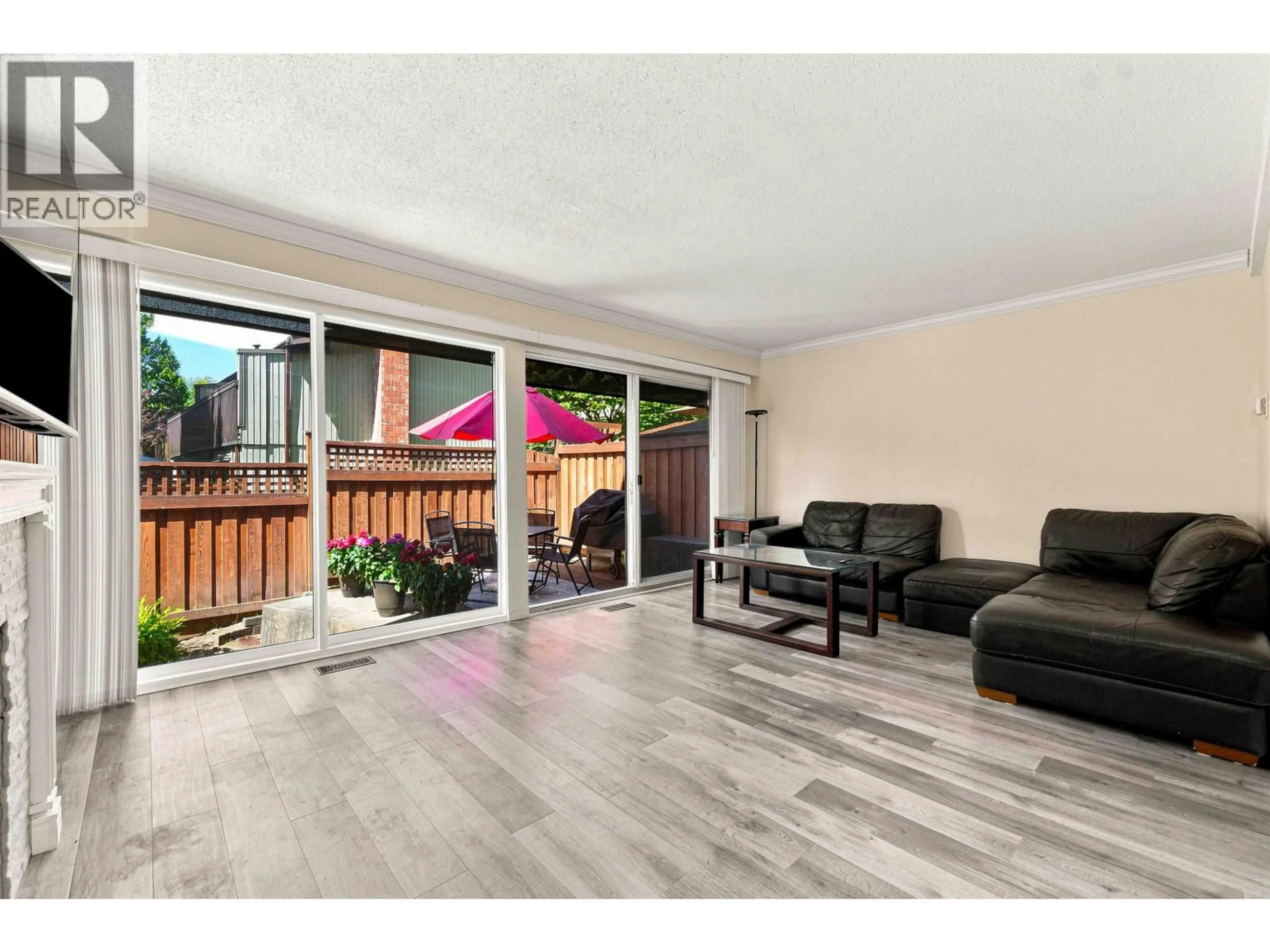 Living room with furniture, wood/laminate floor for 3023 CENTAURUS DRIVE, Burnaby British Columbia V3J1A6