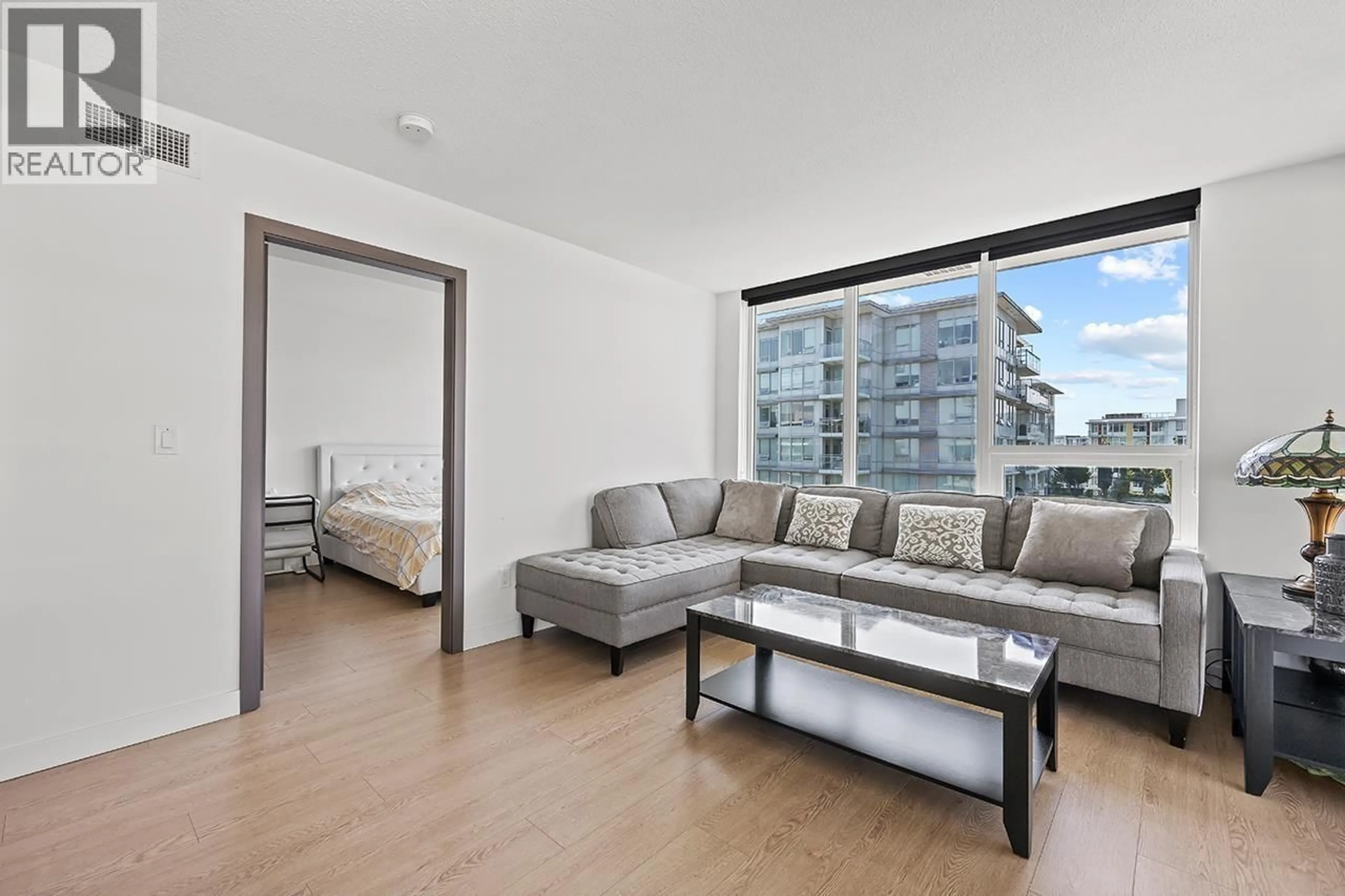 Living room with furniture, wood/laminate floor for 1609 - 3233 KETCHESON ROAD, Richmond British Columbia V6X0R3