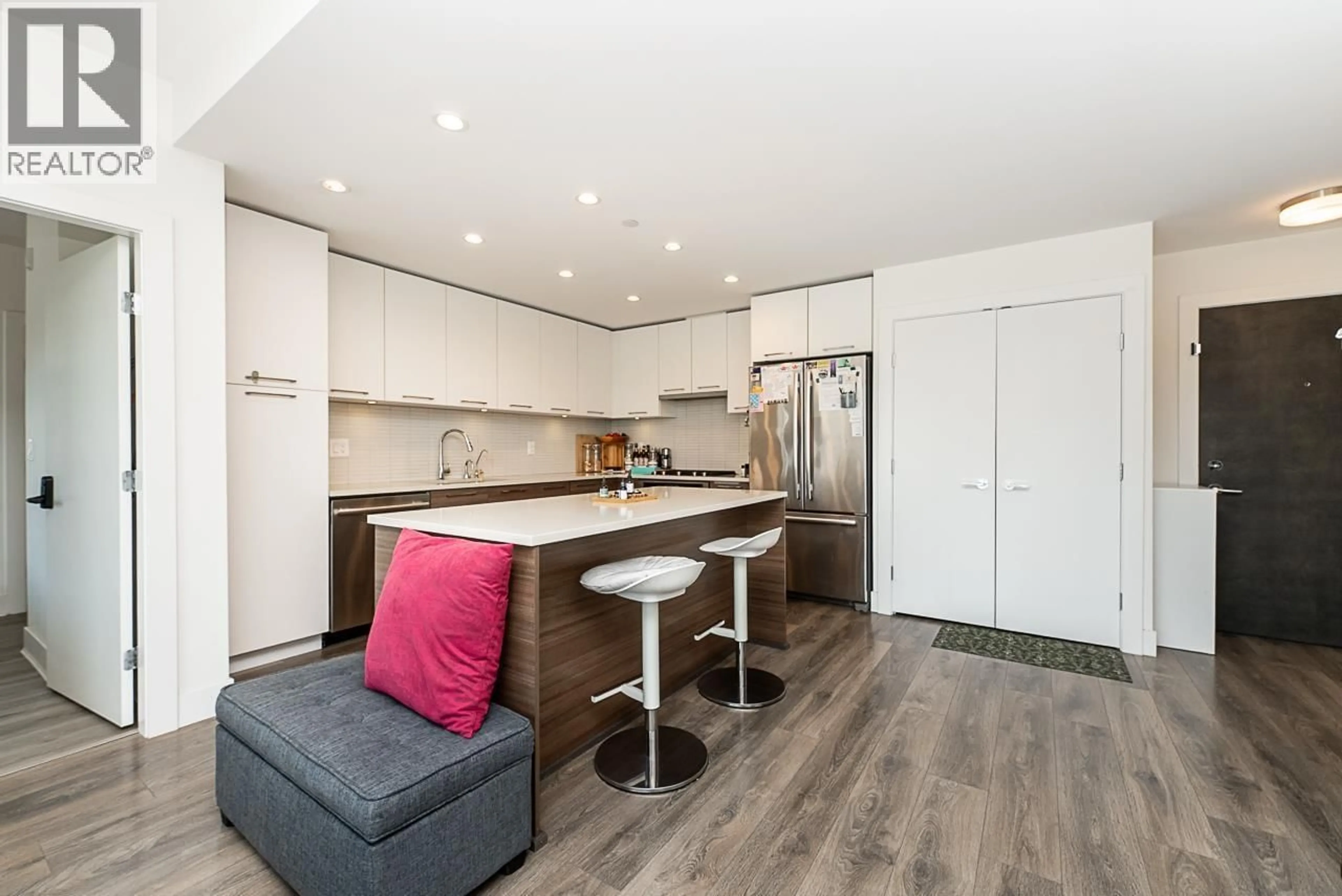 Open concept kitchen, wood/laminate floor for 503 - 3488 SAWMILL CRESCENT, Vancouver British Columbia V5S0C7