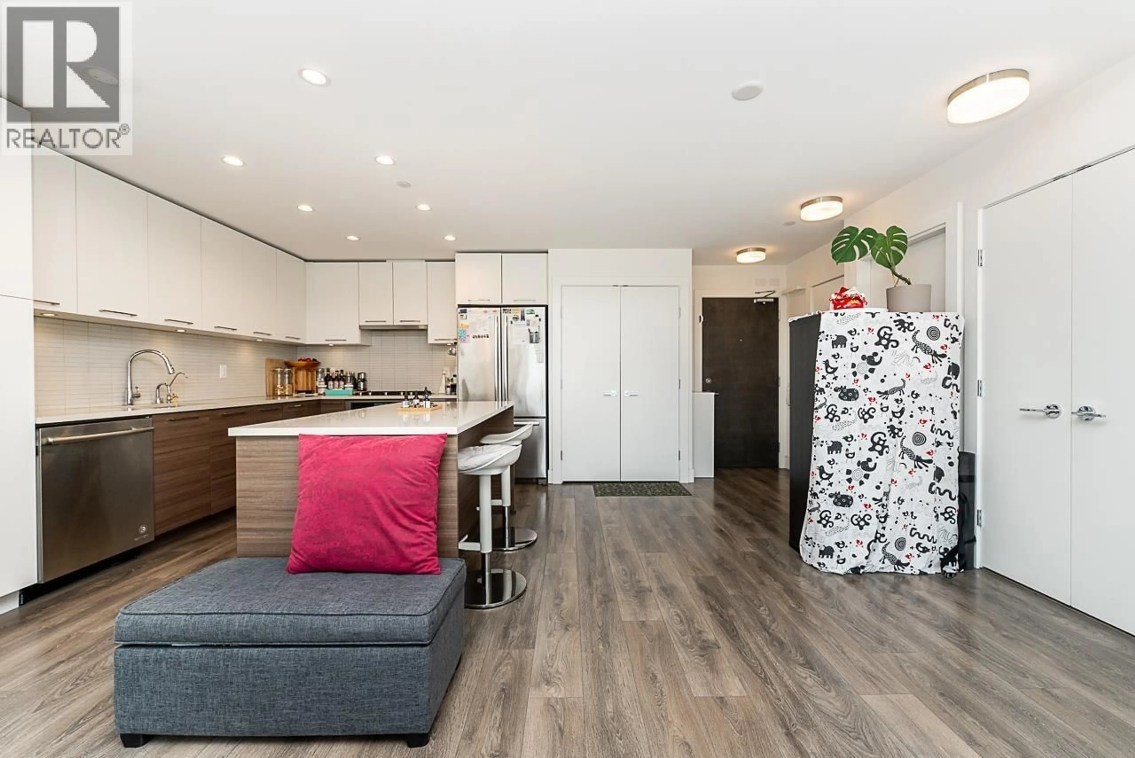 Open concept kitchen, wood/laminate floor for 503 - 3488 SAWMILL CRESCENT, Vancouver British Columbia V5S0C7