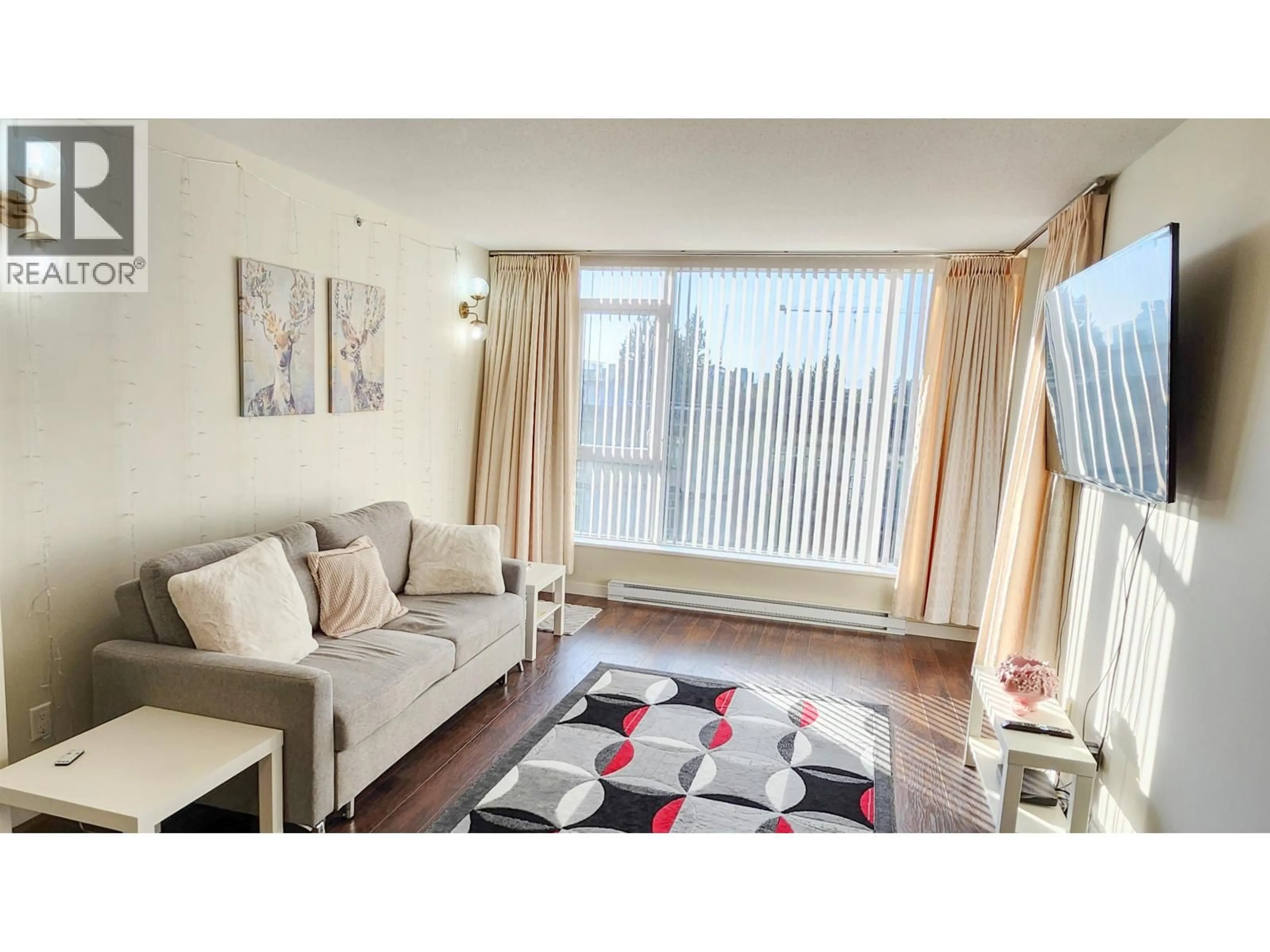 Living room with furniture, wood/laminate floor for 605 - 5868 AGRONOMY ROAD, Vancouver British Columbia V6T0B5