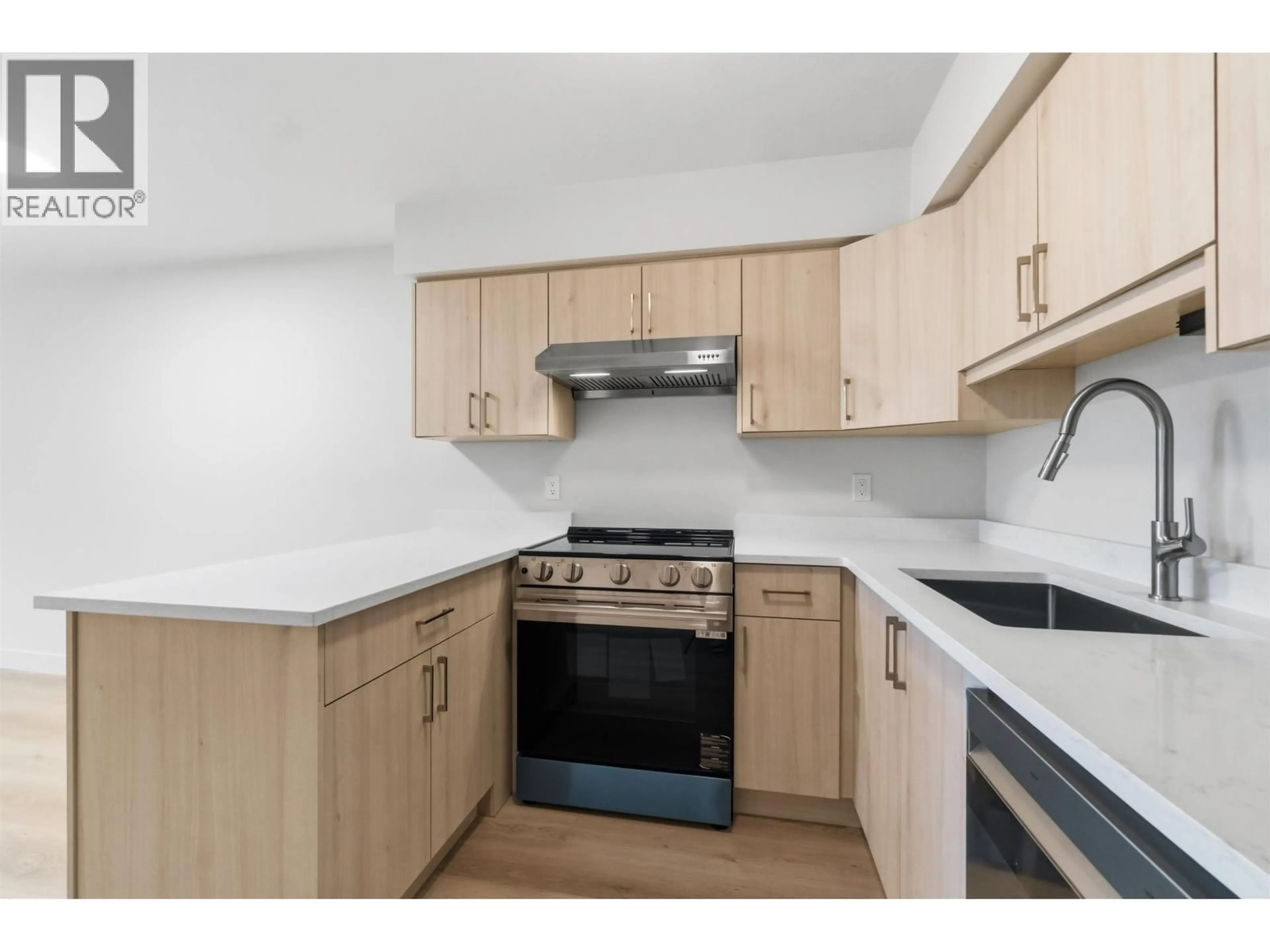 Standard kitchen, wood/laminate floor for 305 - 2928 COMMERCIAL DRIVE, Vancouver British Columbia V5N4C9