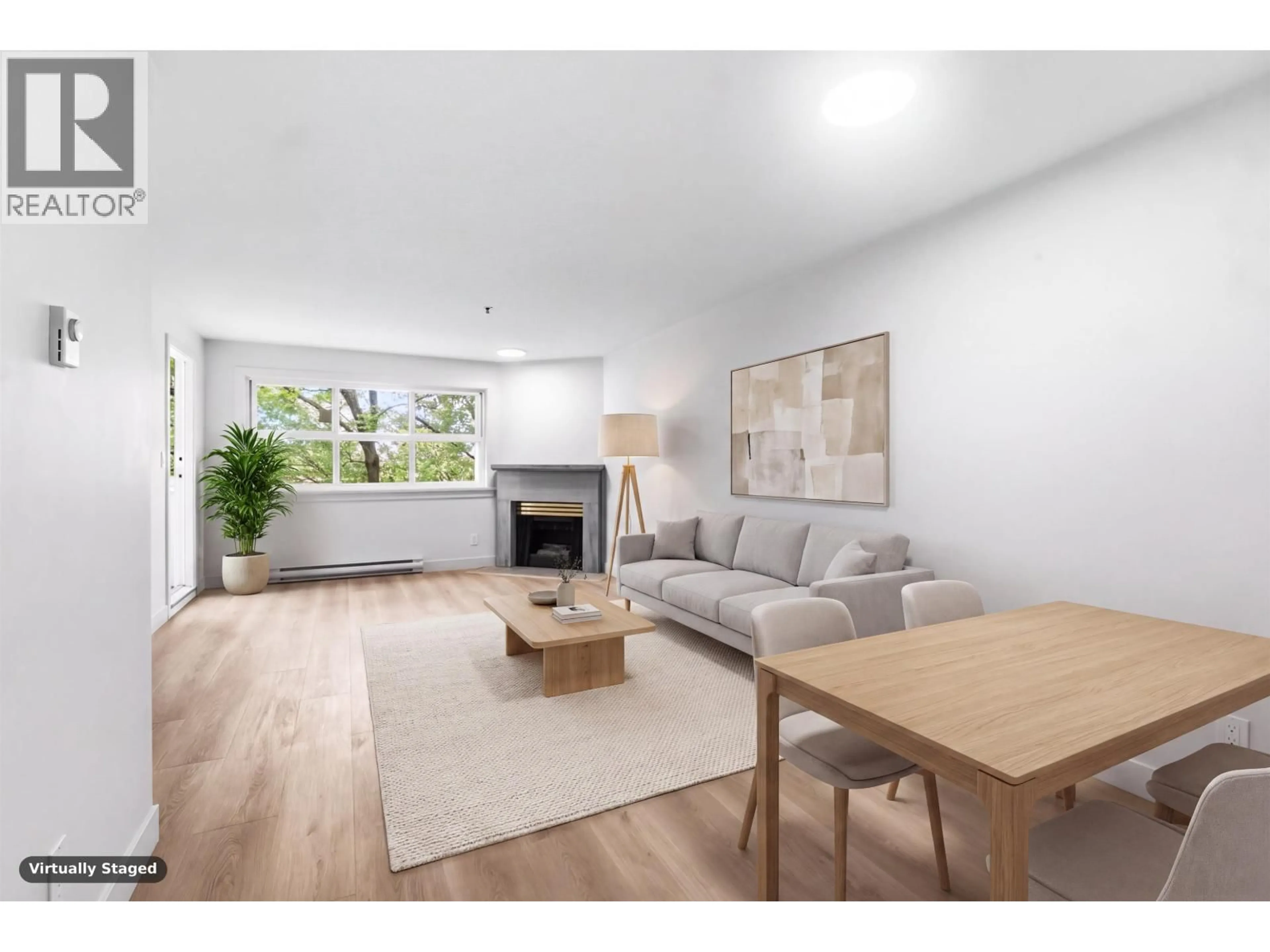 Living room with furniture, wood/laminate floor for 305 - 2928 COMMERCIAL DRIVE, Vancouver British Columbia V5N4C9