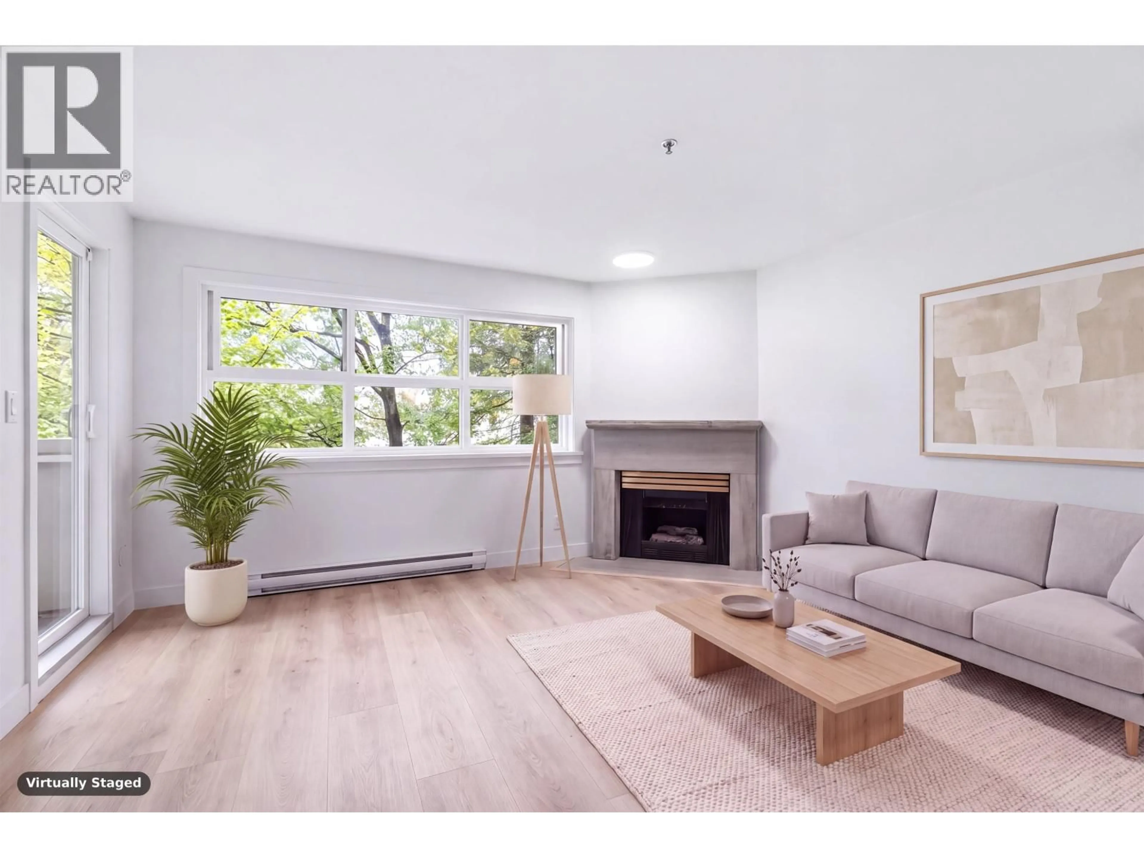 Living room with furniture, wood/laminate floor for 305 - 2928 COMMERCIAL DRIVE, Vancouver British Columbia V5N4C9