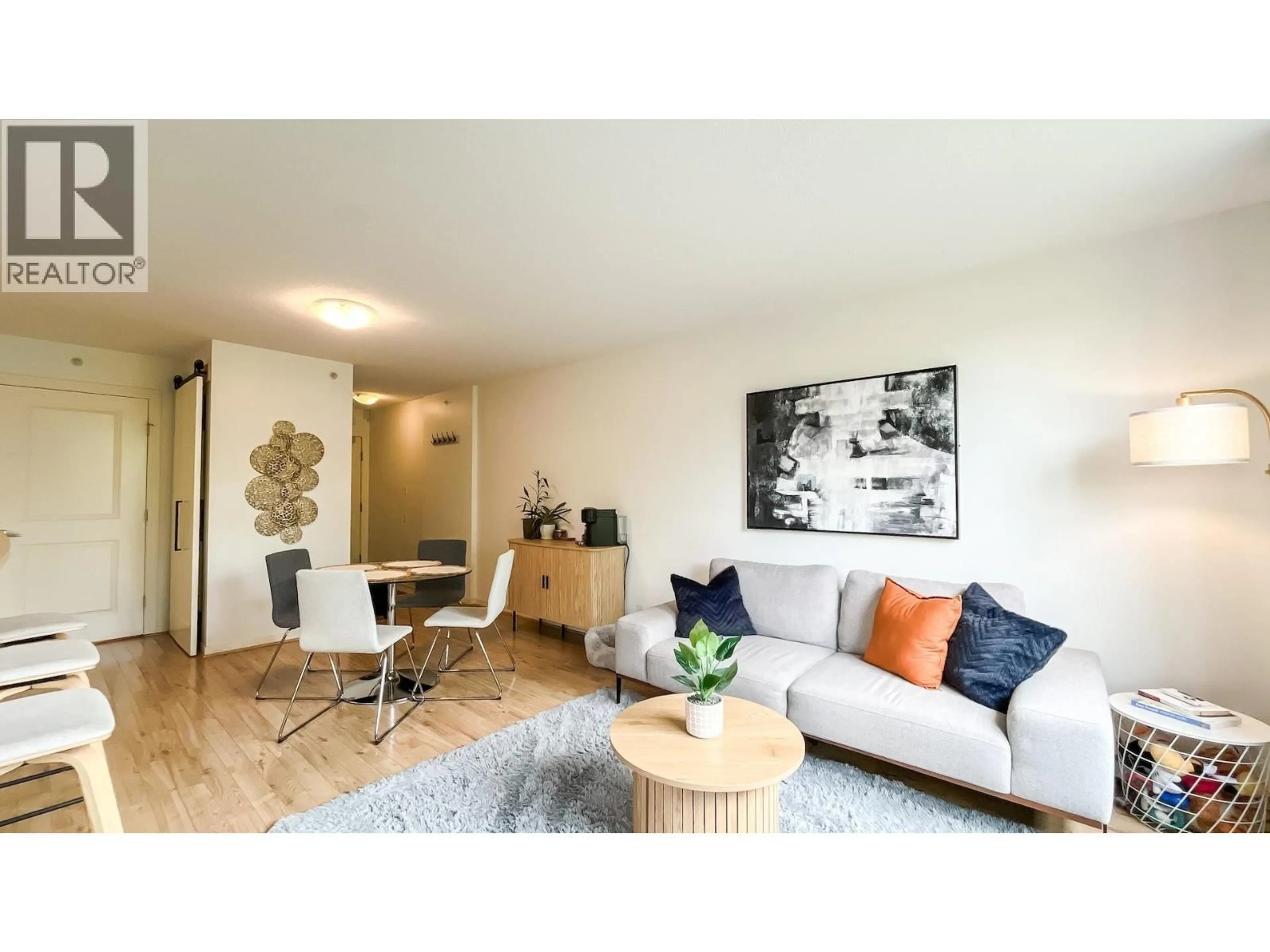 Living room with furniture, wood/laminate floor for 305 - 3638 VANNESS AVENUE, Vancouver British Columbia V5R6H6