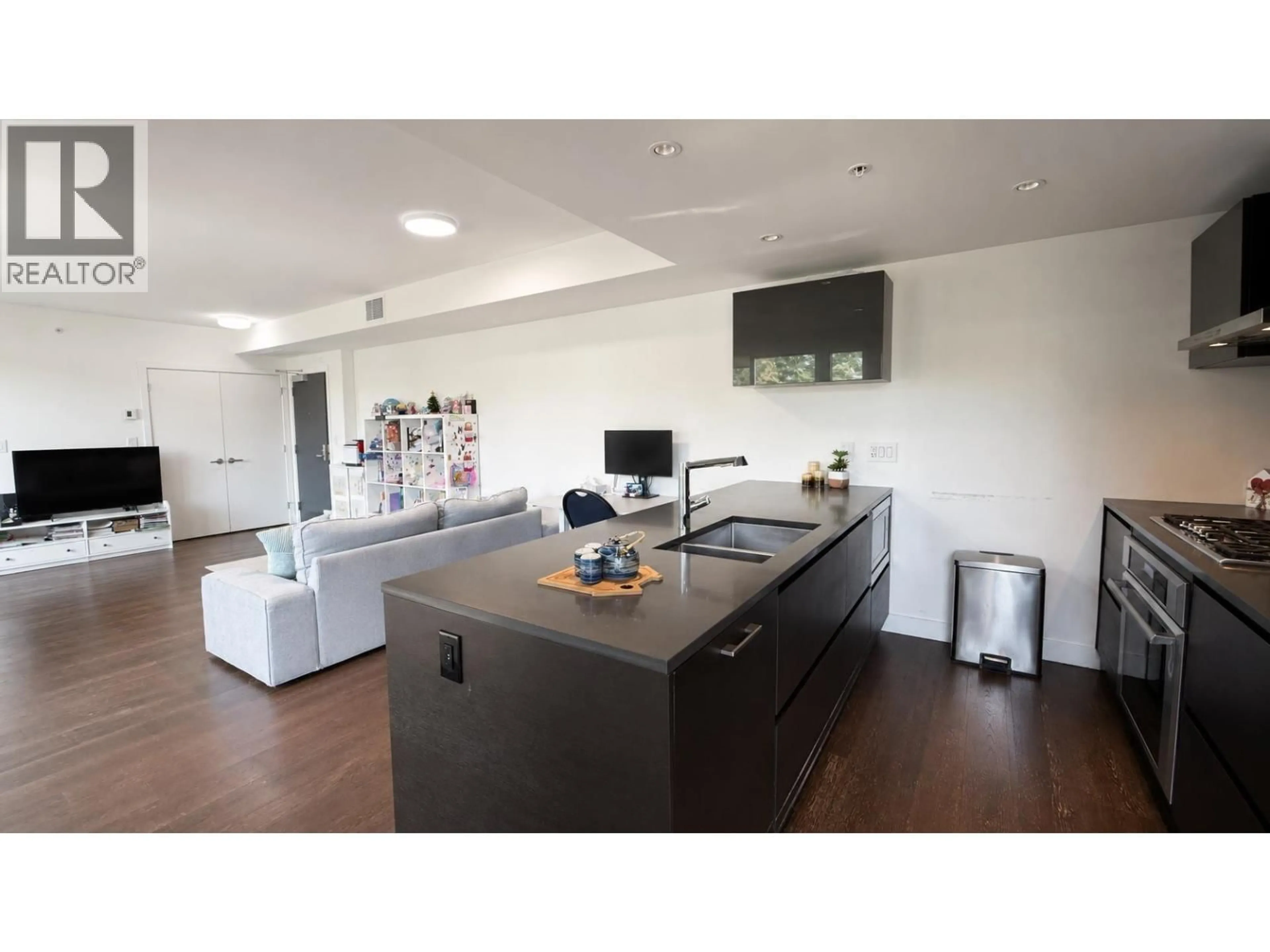 Open concept kitchen, wood/laminate floor for 808 - 1561 57TH AVENUE, Vancouver British Columbia V6P0H5