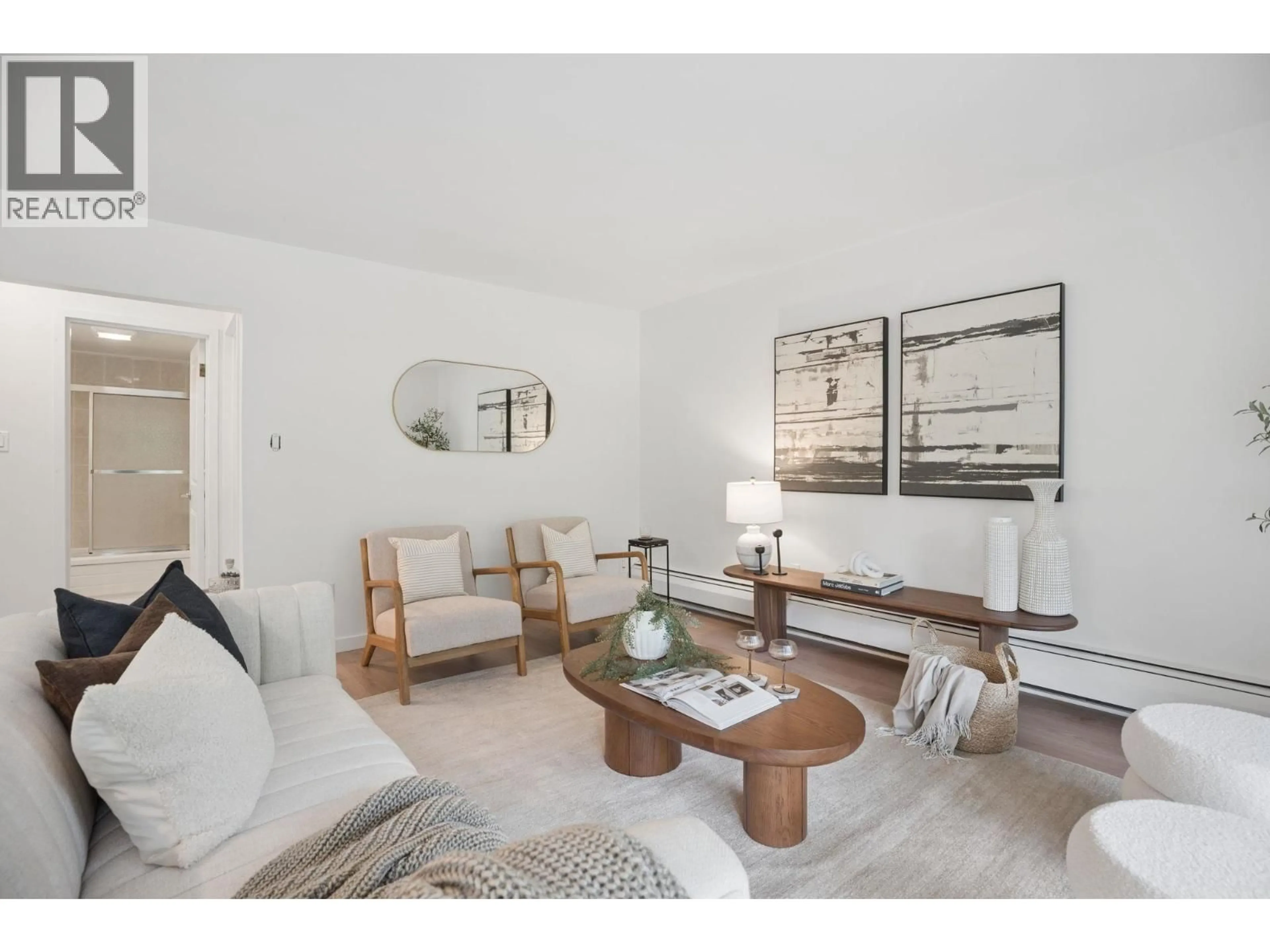 Living room with furniture, wood/laminate floor for 305 - 1945 WOODWAY PLACE, Burnaby British Columbia V5B4S4