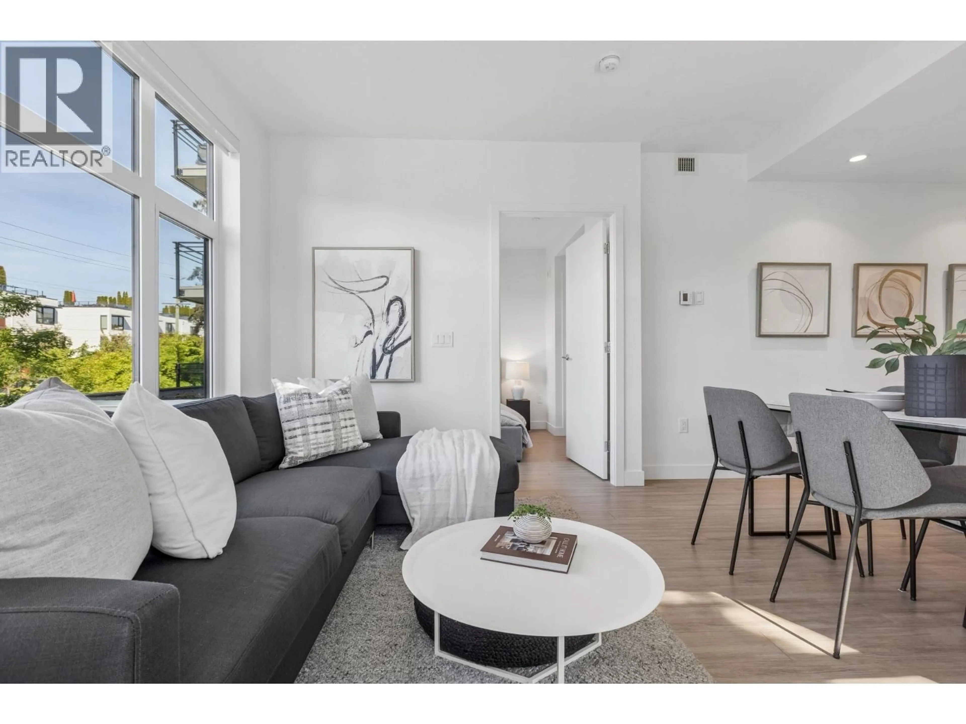 Living room with furniture, unknown for 201 - 707 3 STREET, North Vancouver British Columbia V7L1G8