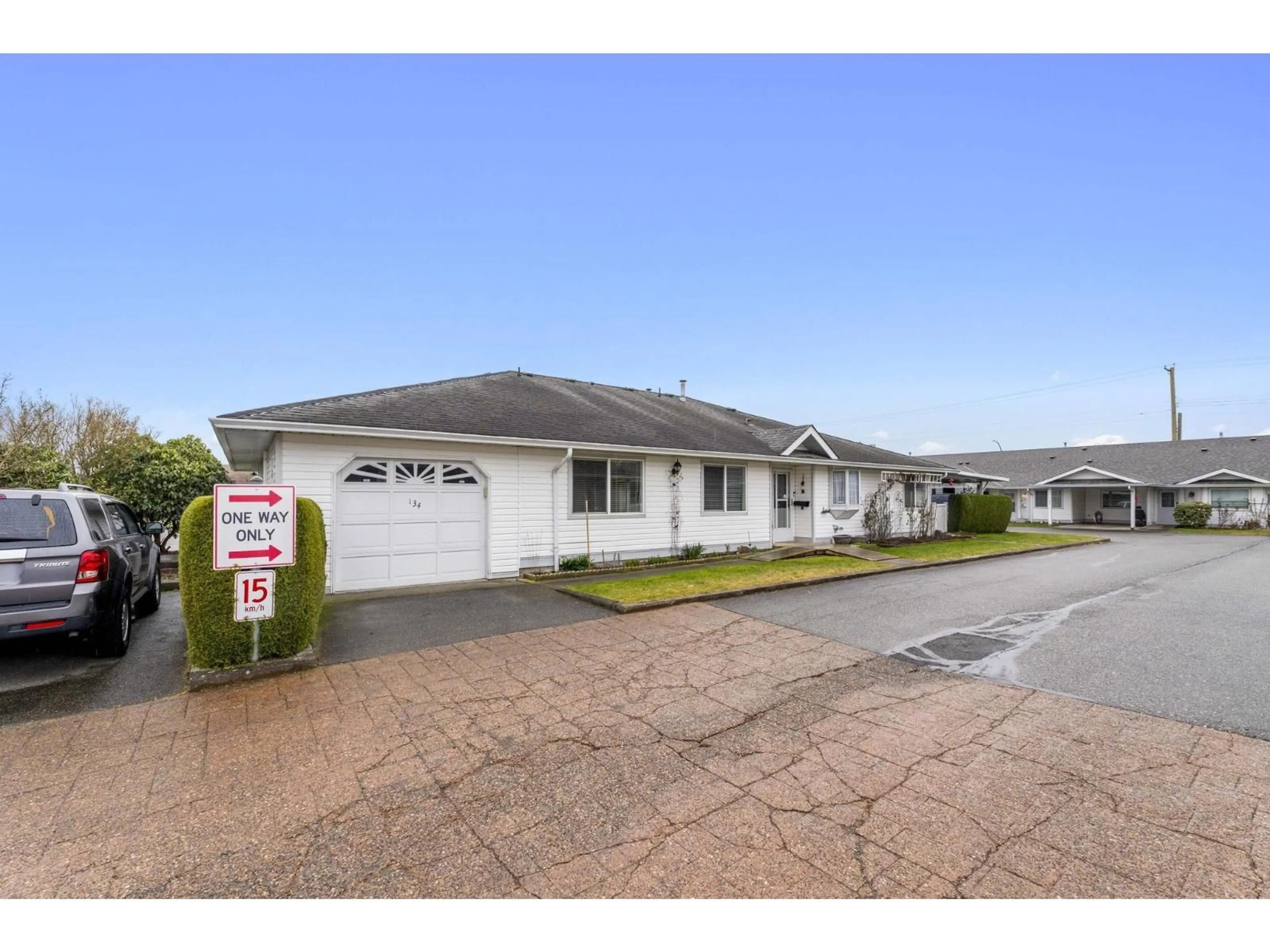 A pic from outside/outdoor area/front of a property/back of a property/a pic from drone, street for 134 - 7610 EVANS ROAD, Chilliwack British Columbia V2R2T4