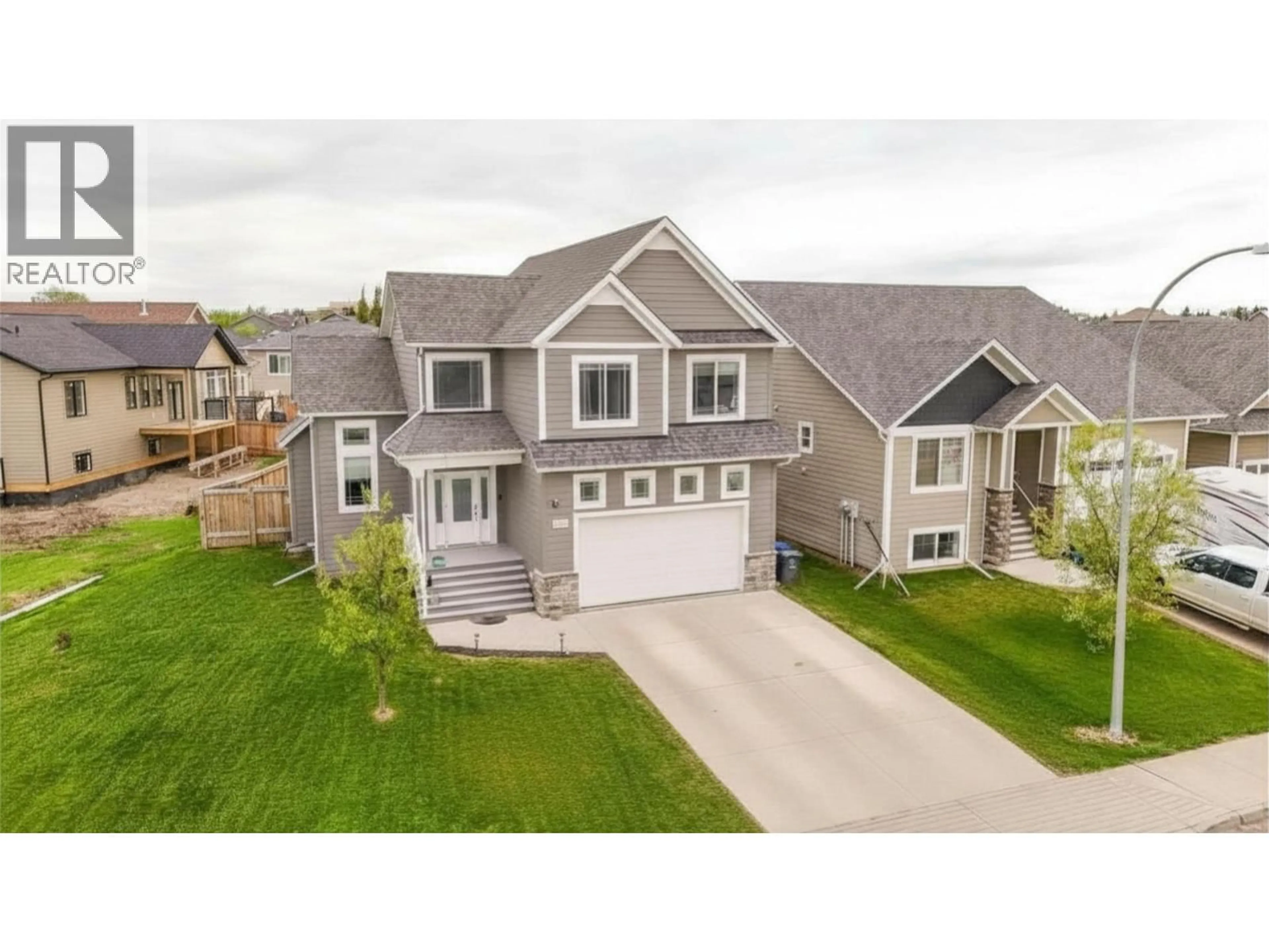 A pic from outside/outdoor area/front of a property/back of a property/a pic from drone, street for 10303 117 AVENUE, Fort St. John British Columbia V1J0M8