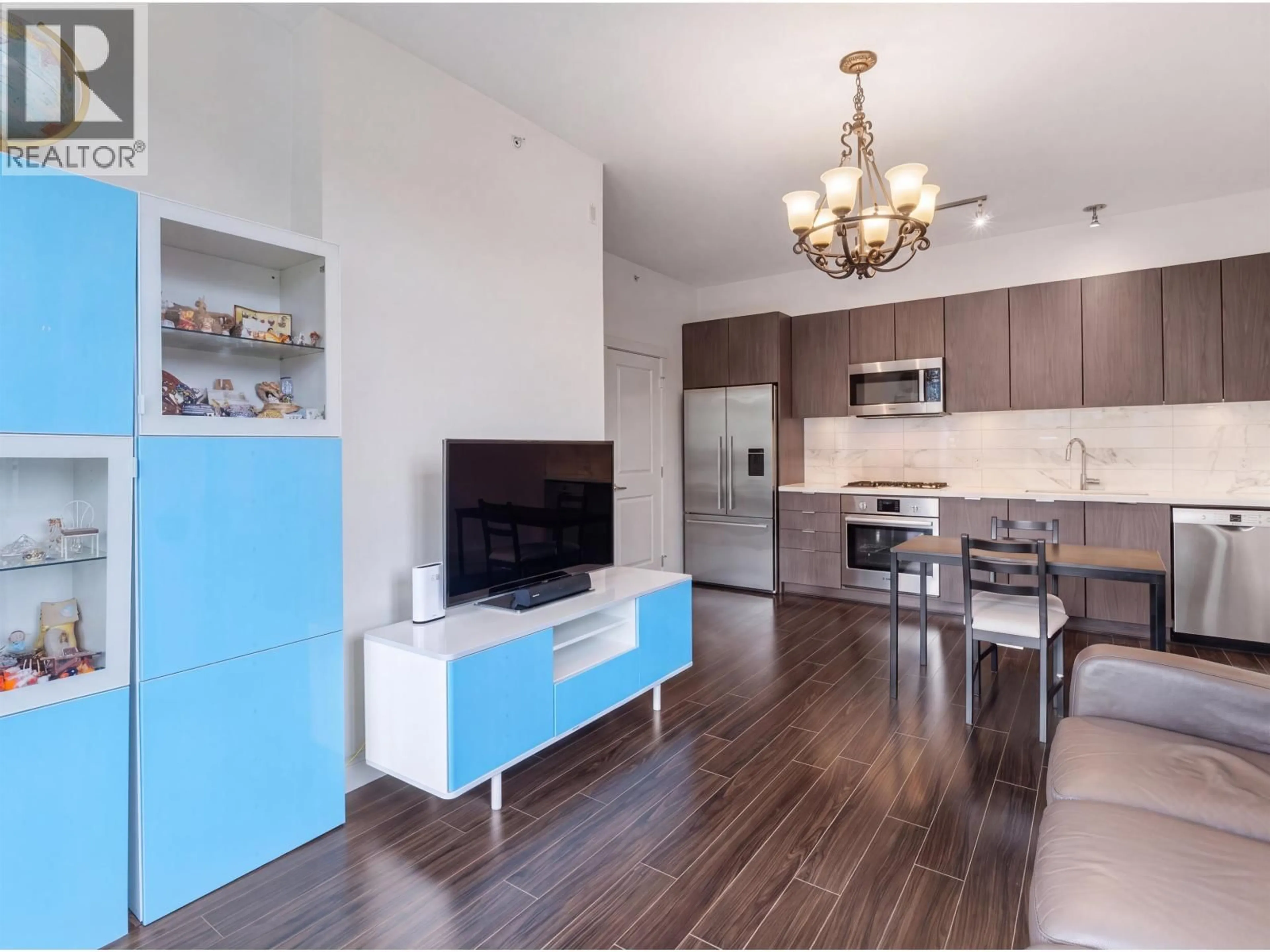 Open concept kitchen, wood/laminate floor for 301 - 3168 RIVERWALK AVENUE, Vancouver British Columbia V5S0B8