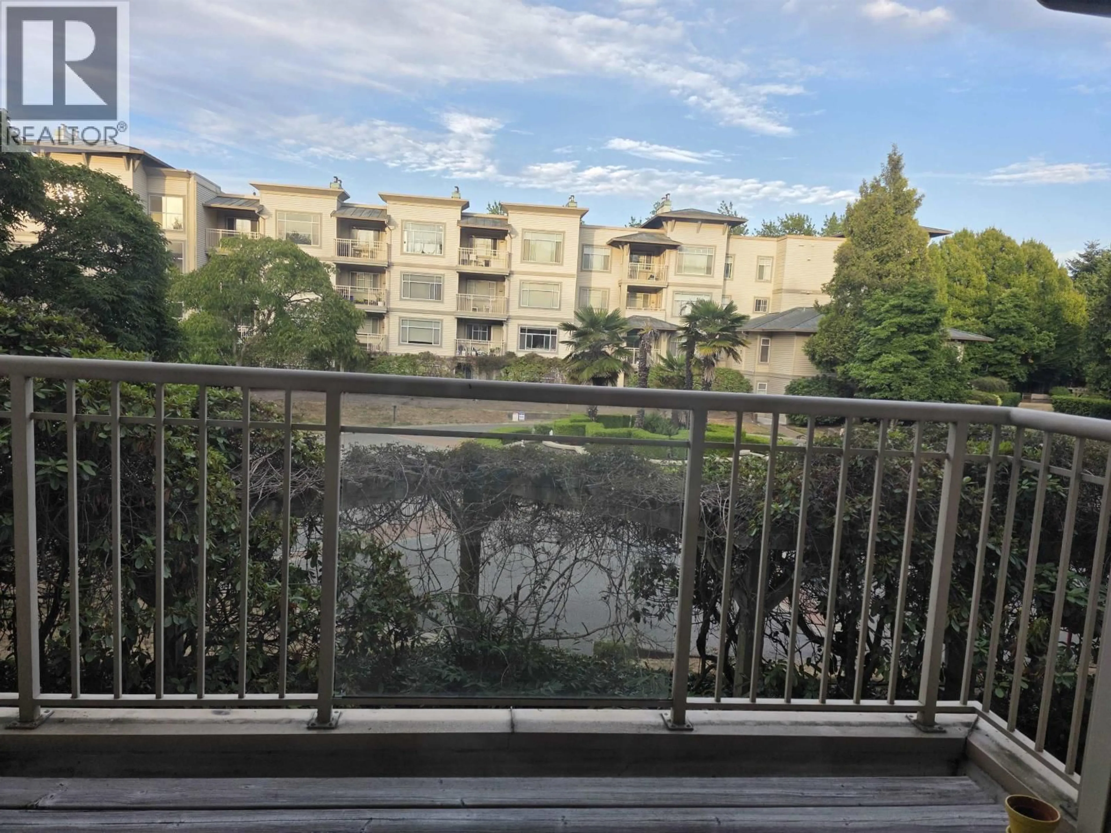 Balcony in the apartment, city buildings view from balcony for 203 - 8180 JONES ROAD, Richmond British Columbia V6Y3Z6