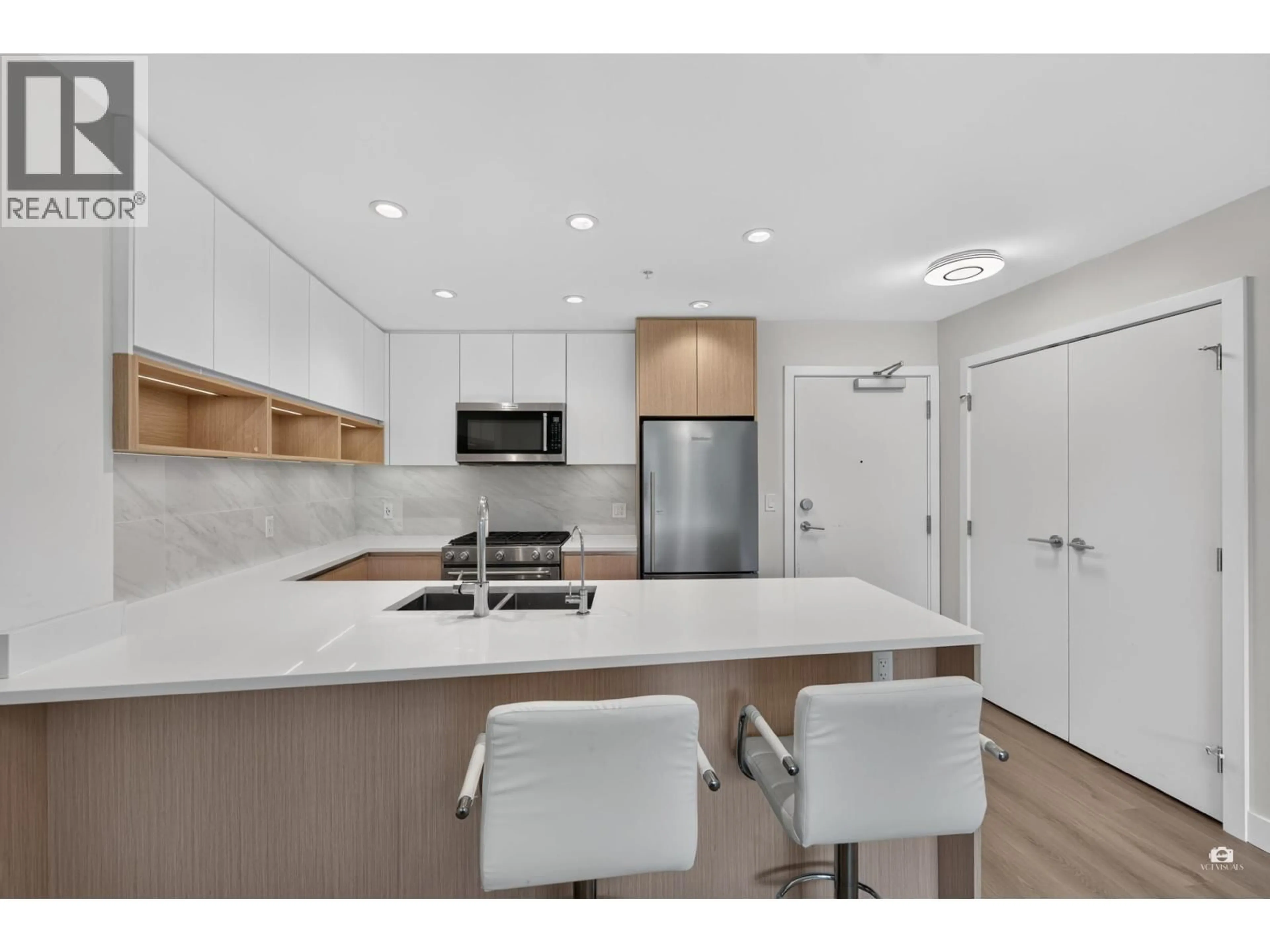 Open concept kitchen, unknown for 105 - 8940 UNIVERSITY CRESCENT, Burnaby British Columbia V5A0E7