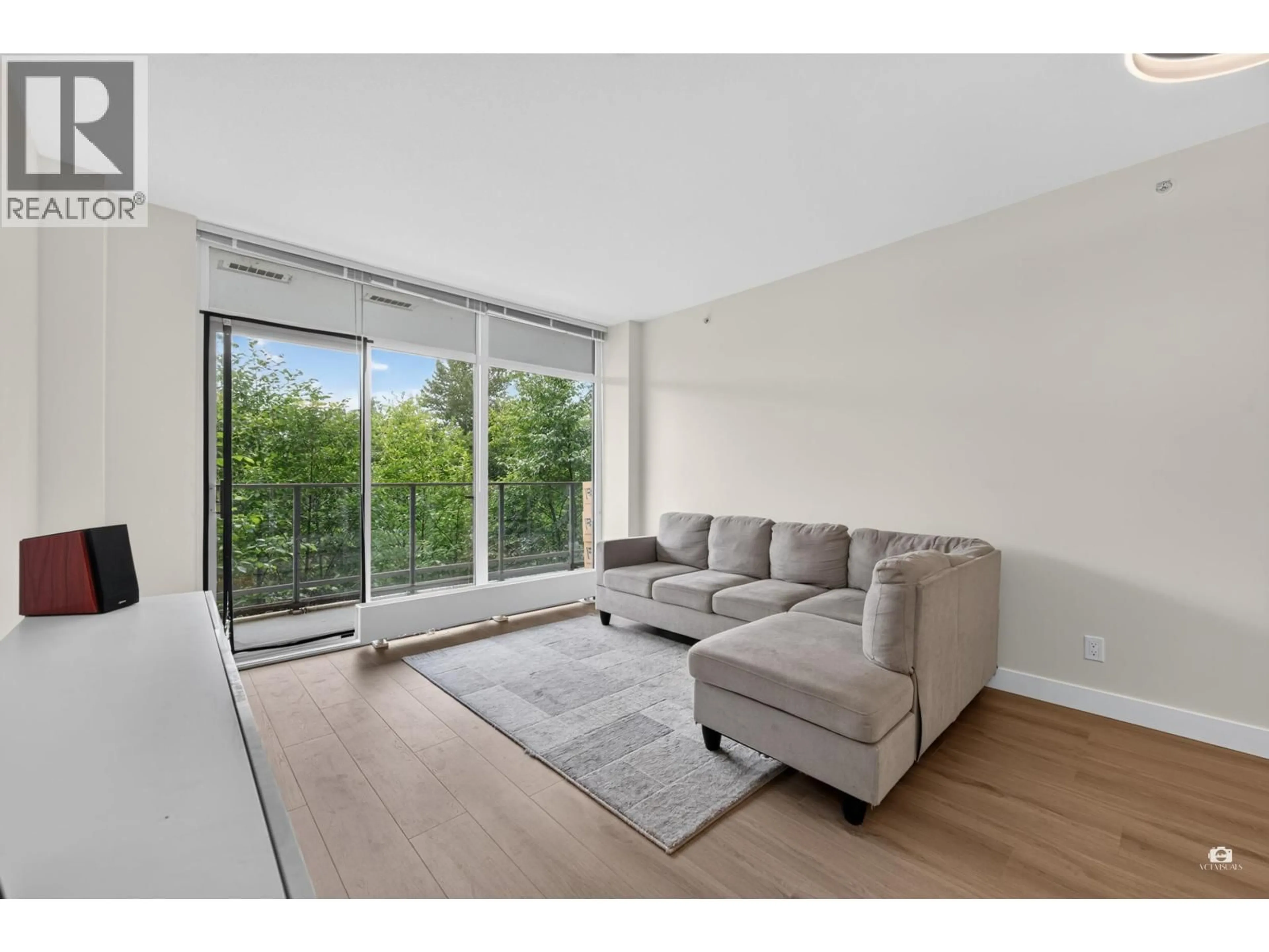 Living room with furniture, unknown for 105 - 8940 UNIVERSITY CRESCENT, Burnaby British Columbia V5A0E7