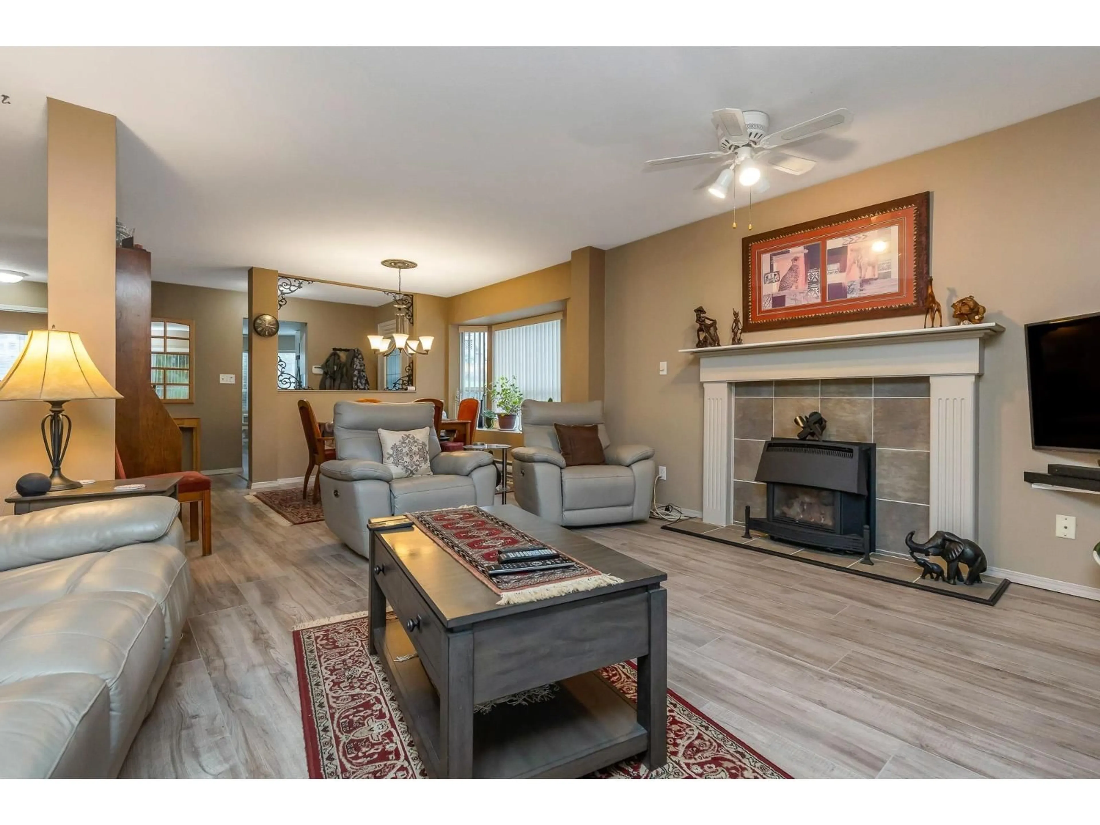 Living room with furniture, wood/laminate floor for 47 - 3380 GLADWIN ROAD, Abbotsford British Columbia V2S7G1