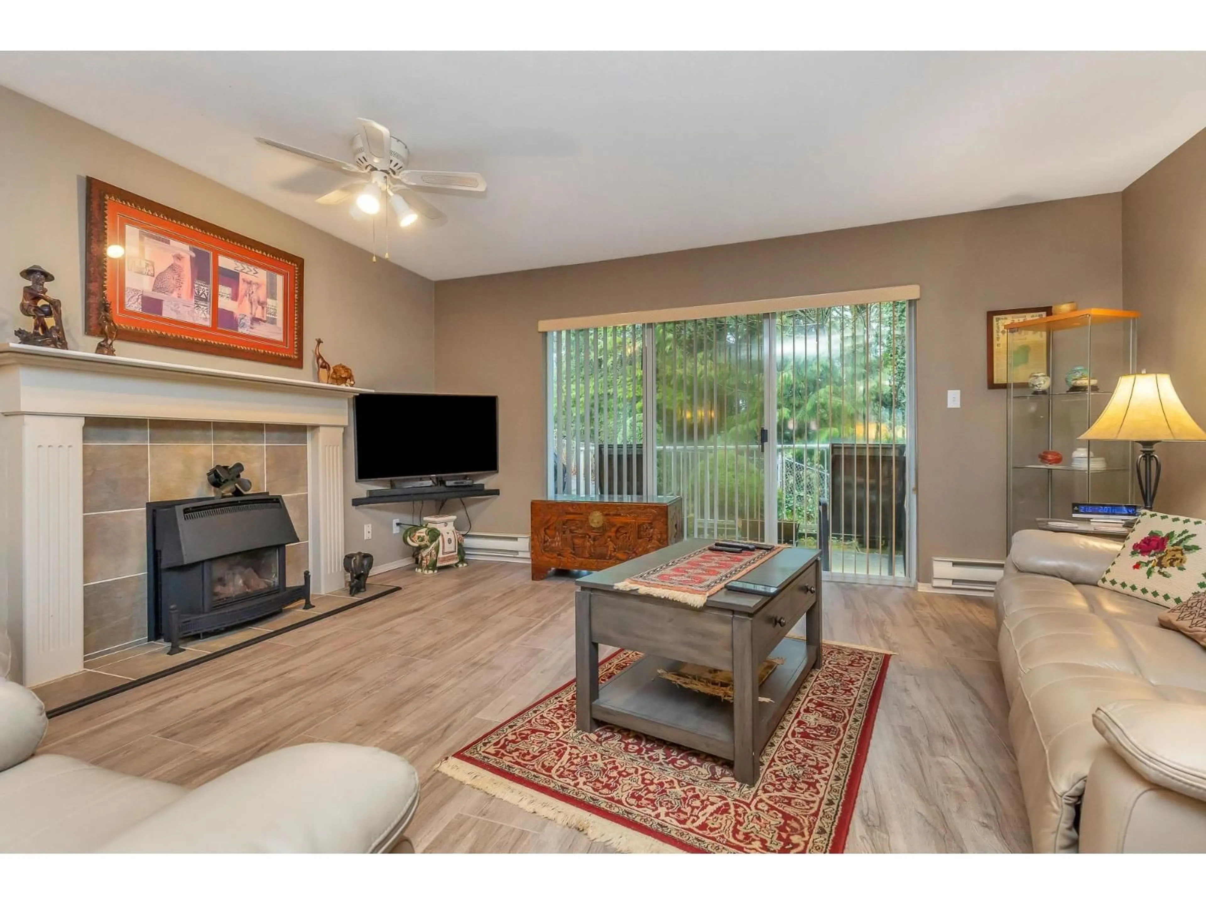 Living room with furniture, wood/laminate floor for 47 - 3380 GLADWIN ROAD, Abbotsford British Columbia V2S7G1