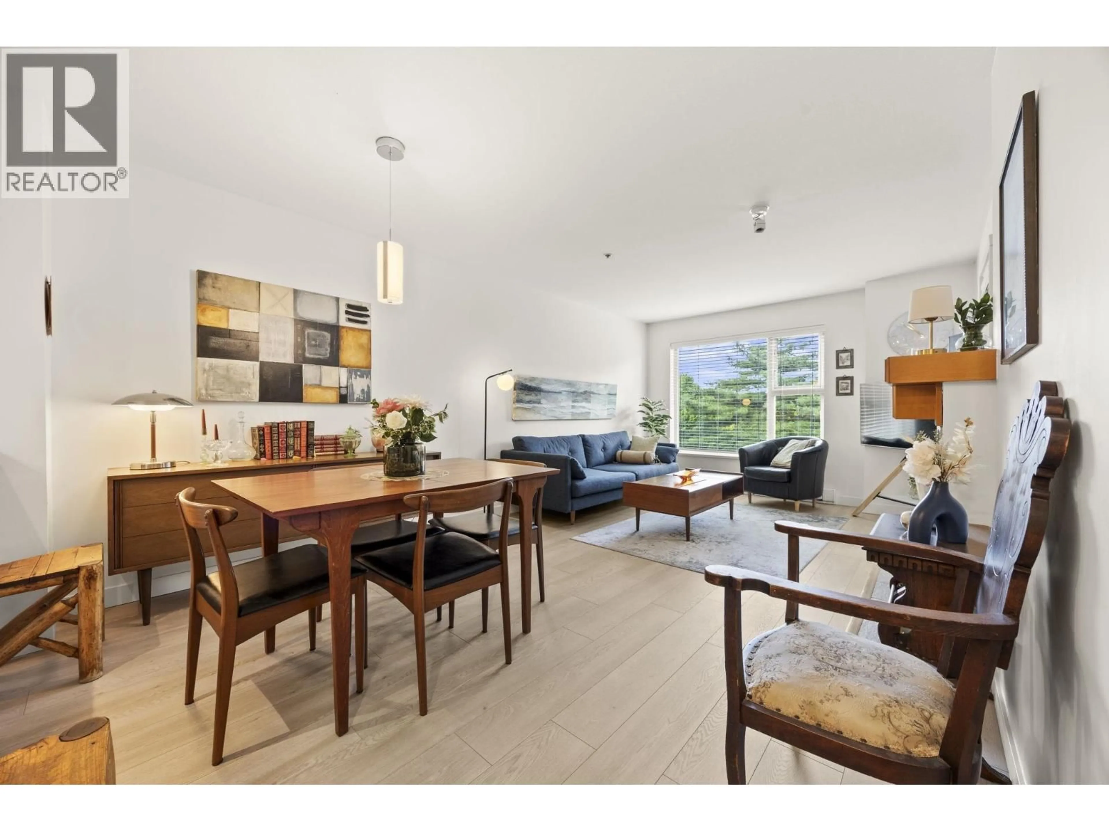 Living room with furniture, wood/laminate floor for 310 - 808 SANGSTER PLACE, New Westminster British Columbia V3L5W3