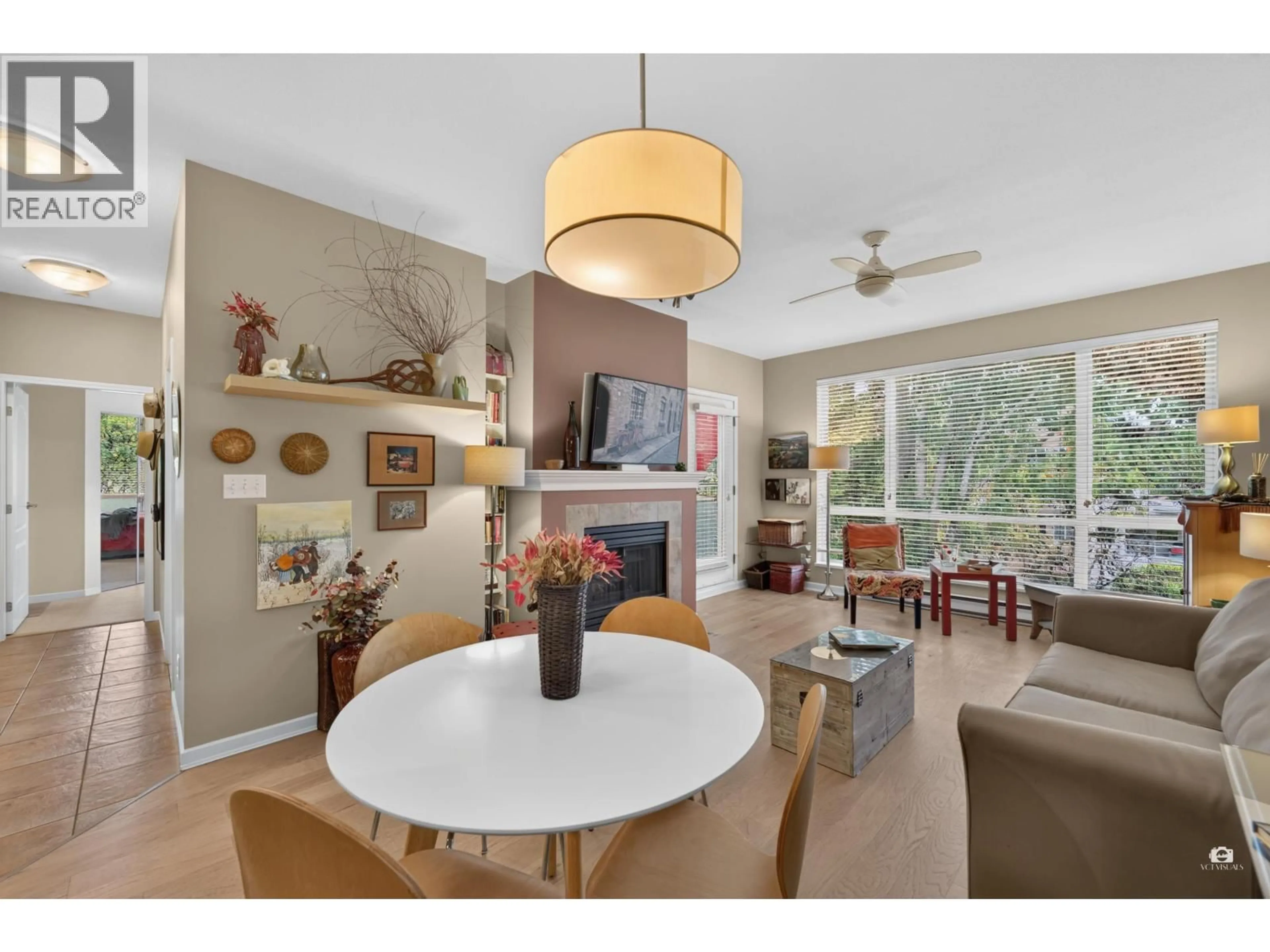 Living room with furniture, wood/laminate floor for 409 - 6742 STATION HILL COURT, Burnaby British Columbia V3N4V2