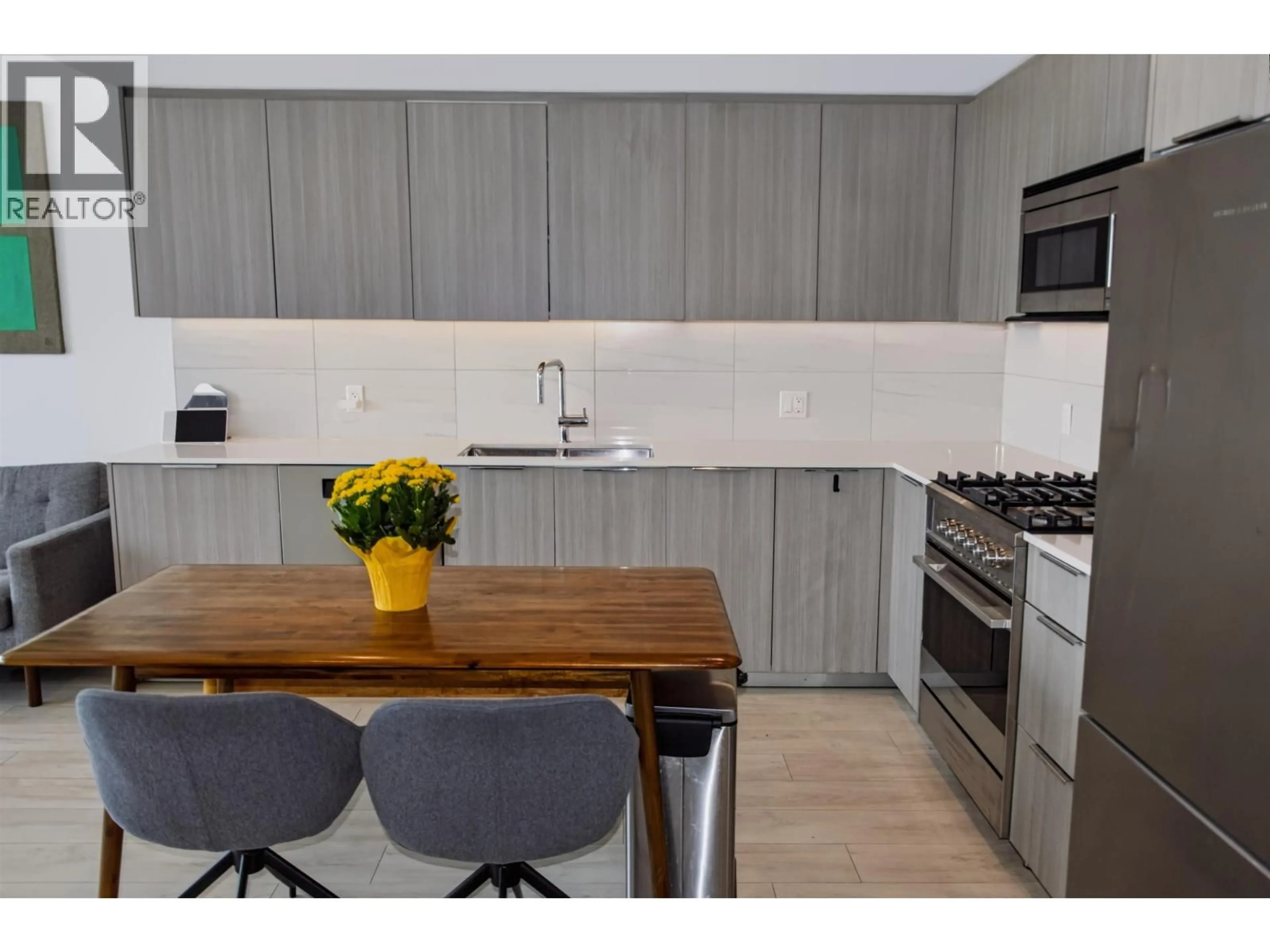 Contemporary kitchen, wood/laminate floor for 405 - 1401 HUNTER STREET, North Vancouver British Columbia V7J0E2