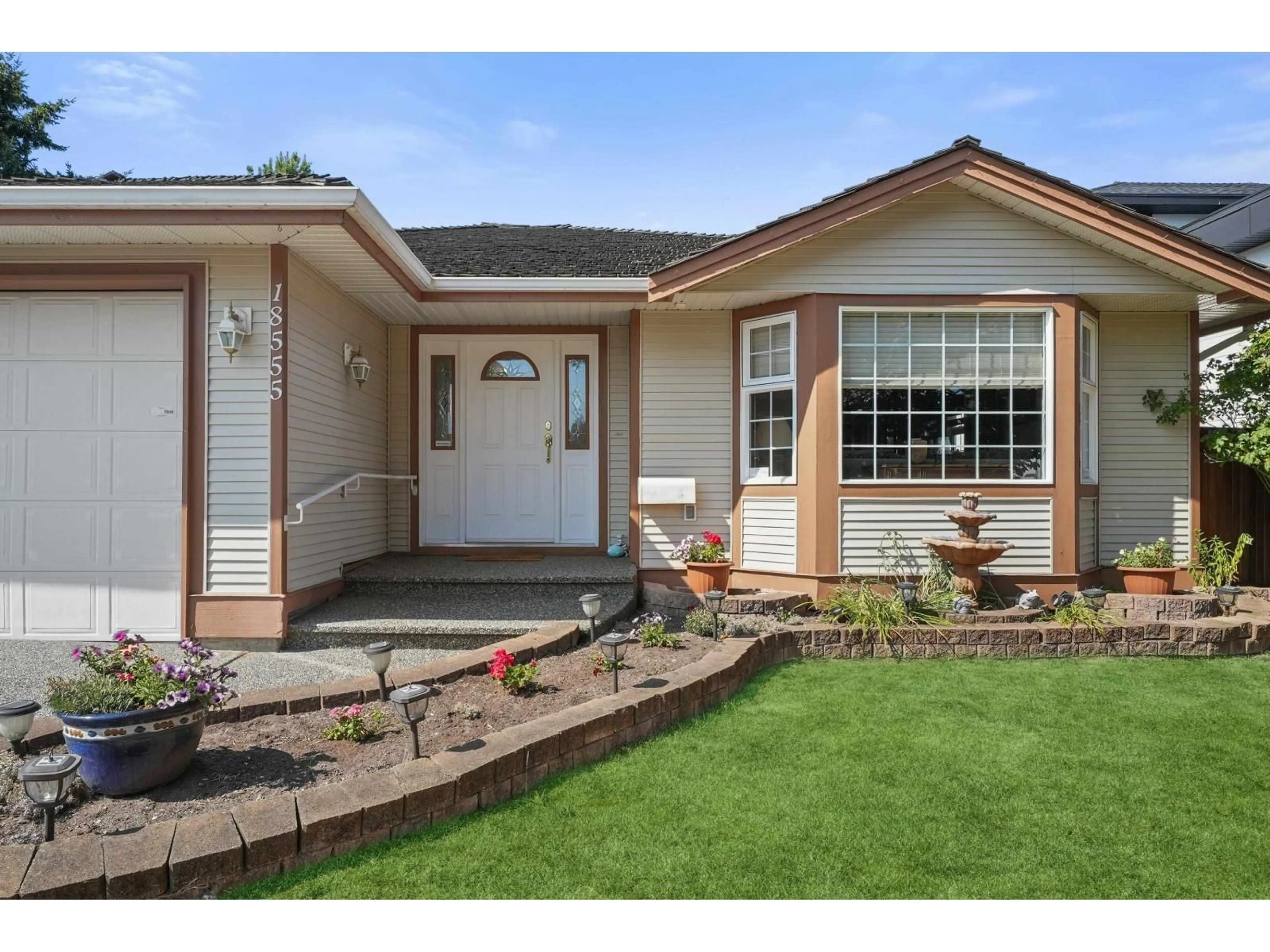 Home with vinyl exterior material, street for 18555 57 AVENUE, Surrey British Columbia V3S7T1